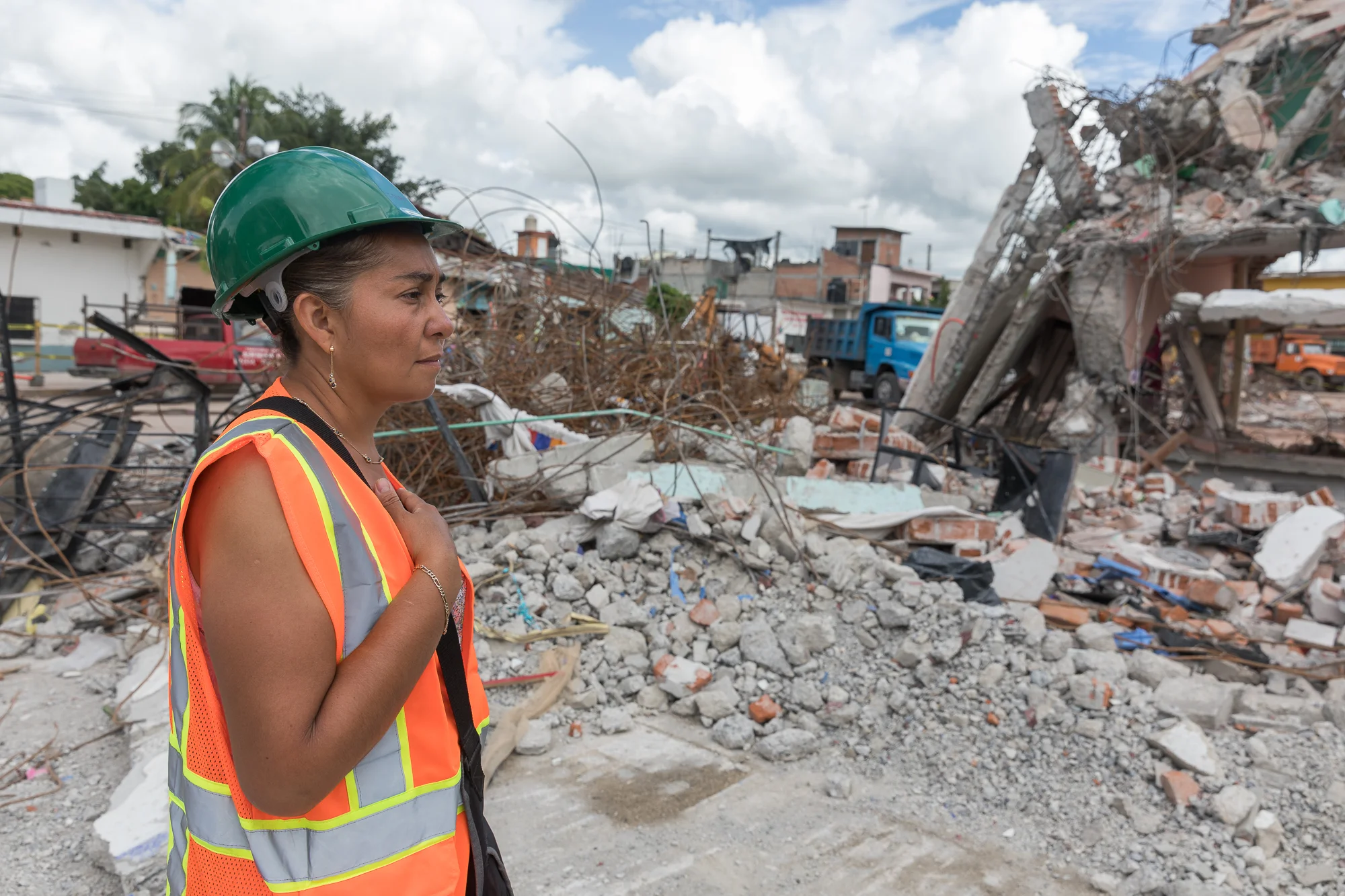 Verónica Bravo Santamaria looking at her home as it is being demolished. Six people lived in the house including her husband, her children Francisco Antonio and Mari José, and her in-laws. They are currently sleeping in their truck. PHOTO: Francisco Alcala Torreslanda