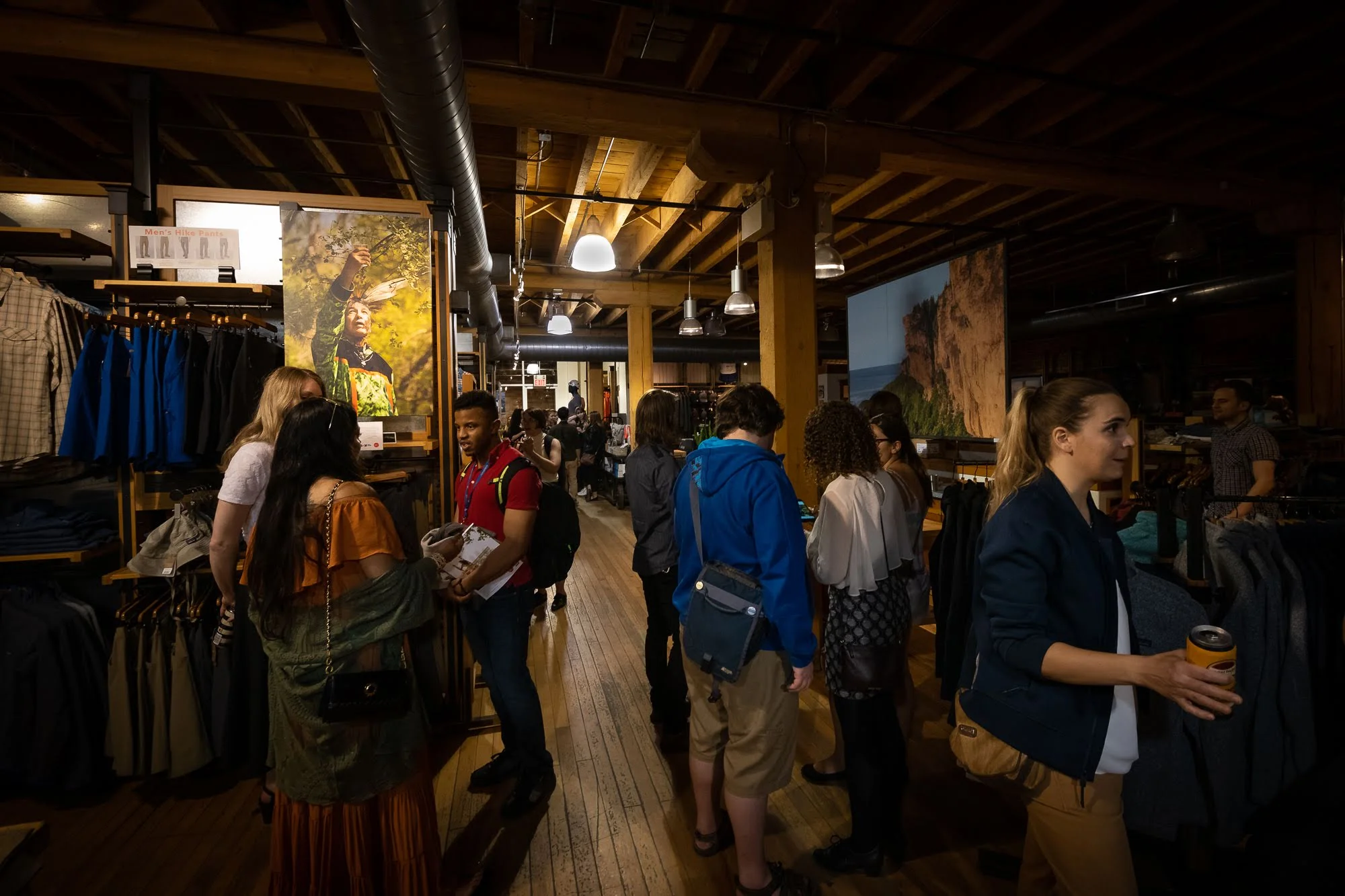 People gather to enjoy the reception for the EVC and CONTACT exhibit, on display at the Patagonia store for the month of May. PHOTO: Dave Coulson