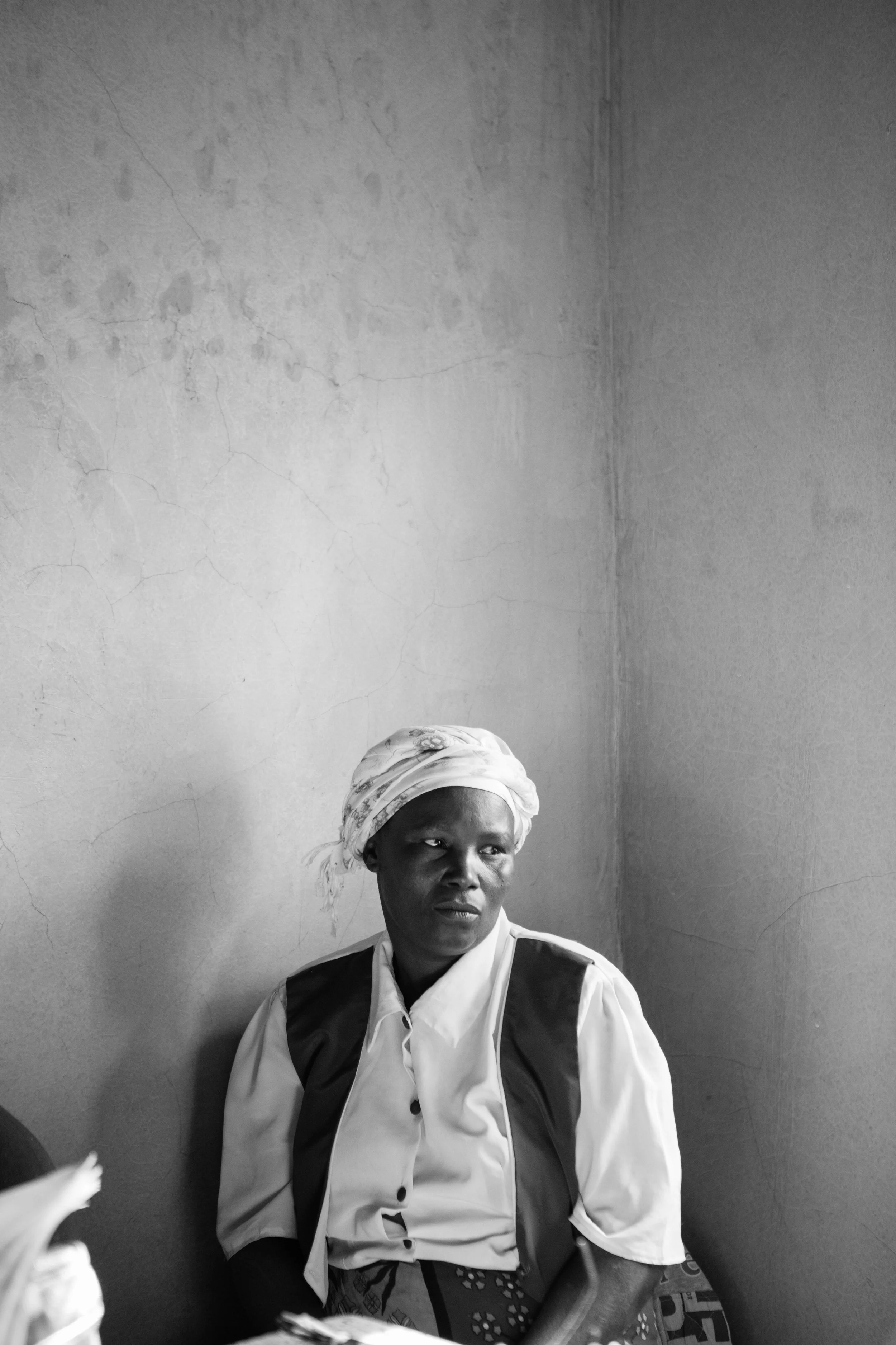 Single mothers group member, Rose Wanjiku. These are some of the women who do laundry in the village, but dream of their own businesses. Rose would like to gain education for how to raise cows in order to produce more milk from the cow she already owns. Photo by Lee Rubin-Jakober