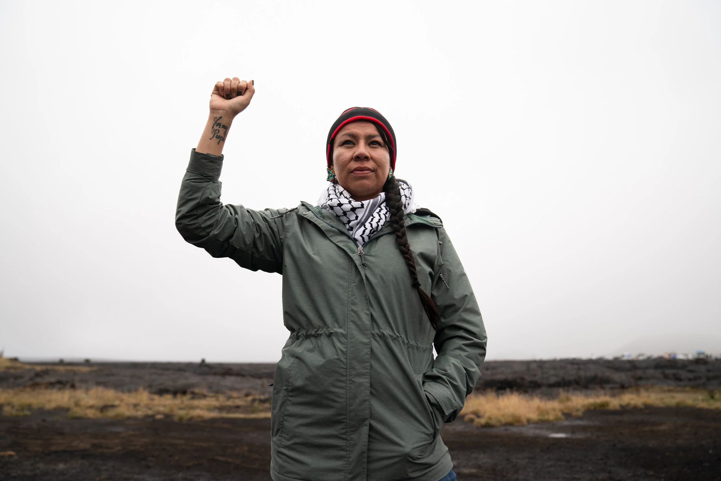 A Cheyenne/Oglala member of “About Face,” an organization comprised of veterans against war, stands with the kia’i (protectors).