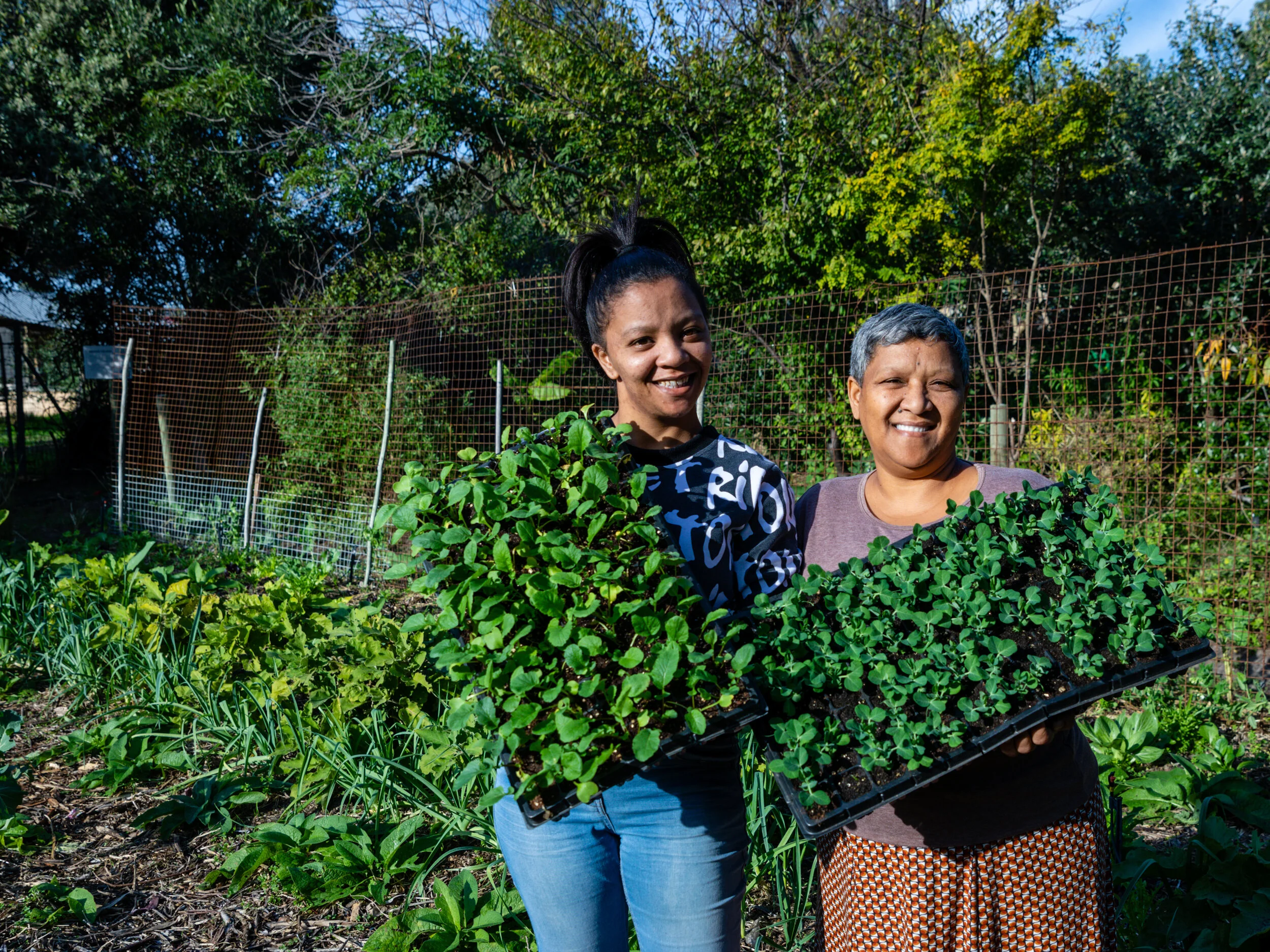 SEED staff member Gail, and her daughter Jessie, care for community gardens. Photo by Lou Gilbert