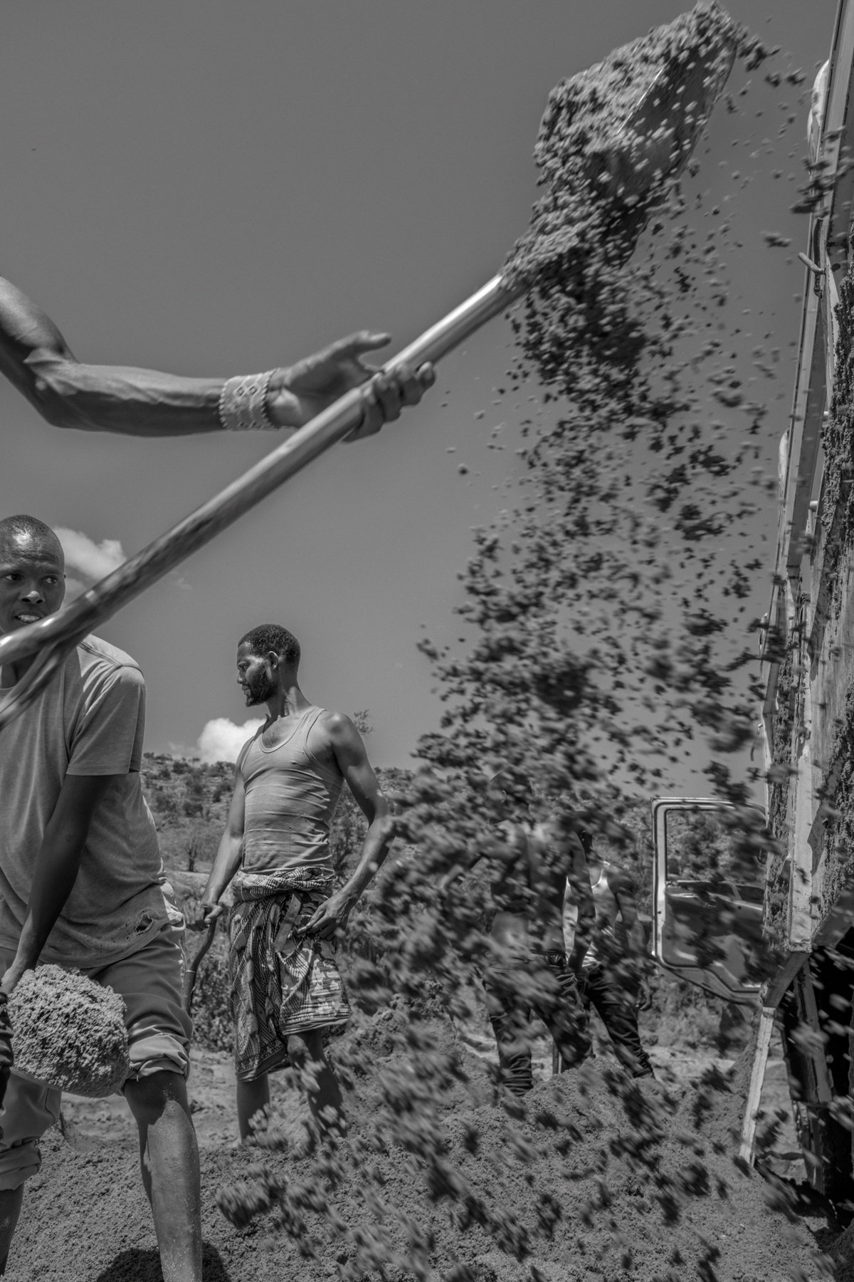  Workers excavate sand from Oloisukut riverbed, Dol Dol, Laikipia county, Kenya. The sand is then taken to construction sites in big cities like Nairobi. 