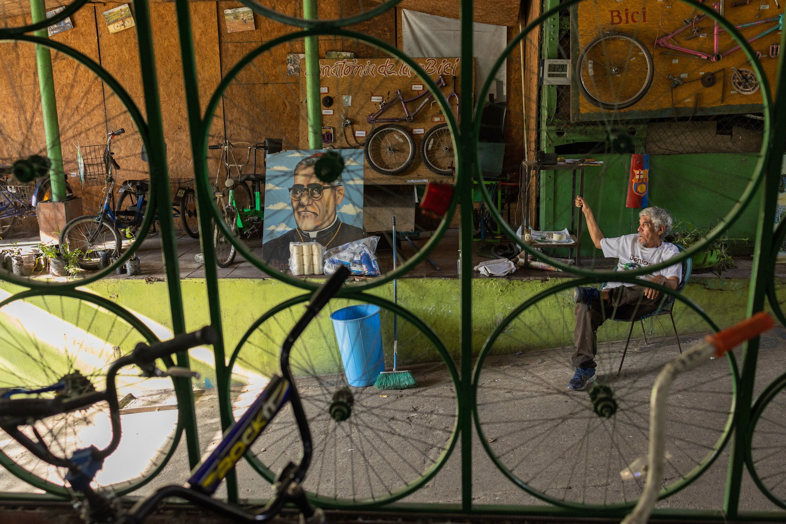  A man watches for customers dropping by the CESTA bike shop.  