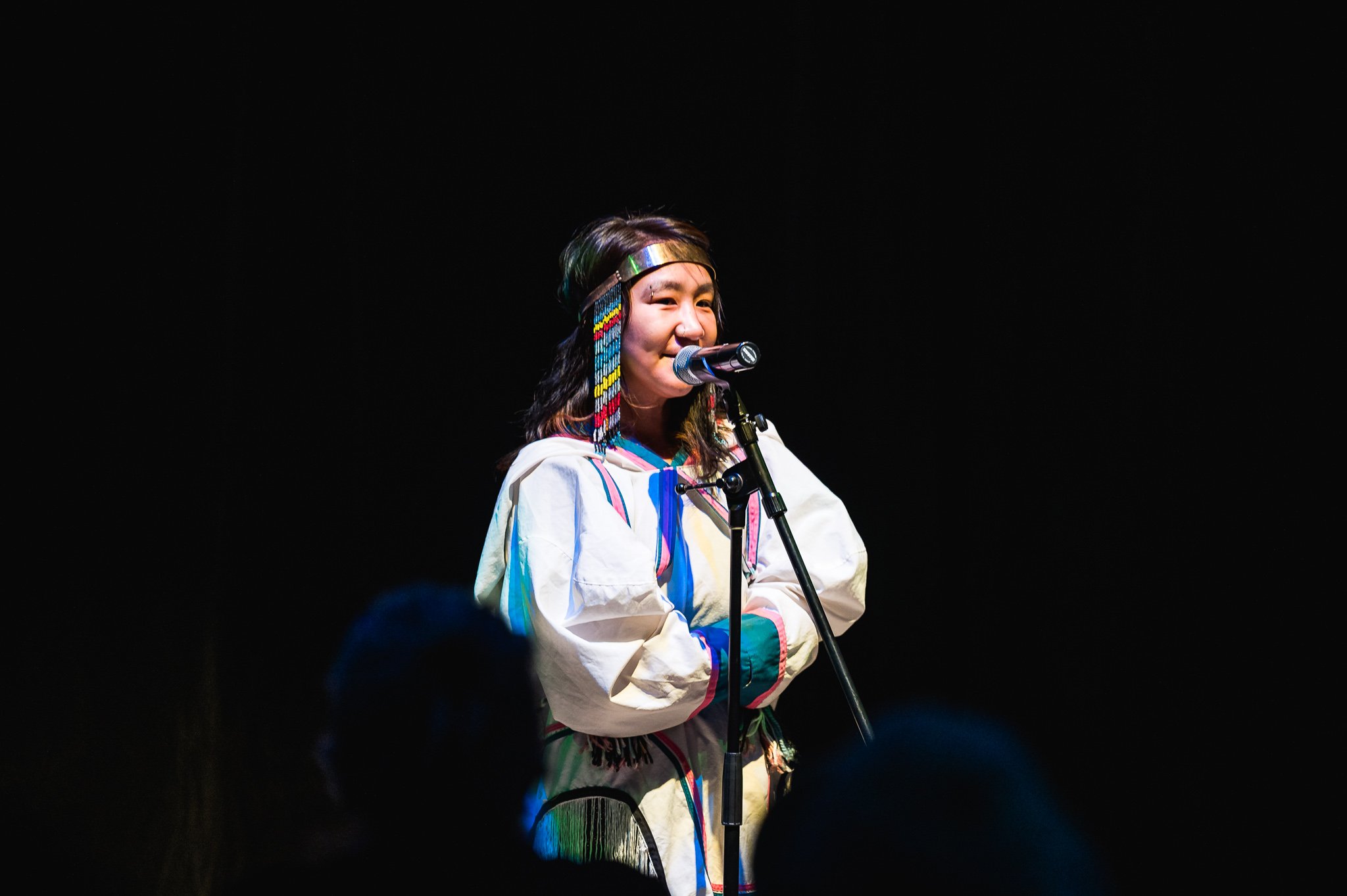 A performer at the Welcome Gathering at the 2022 imagineNATIVE Film + Media Arts Festival in the Daniels Spectrum Ada Slaight Hall. Image by David Coulson.
