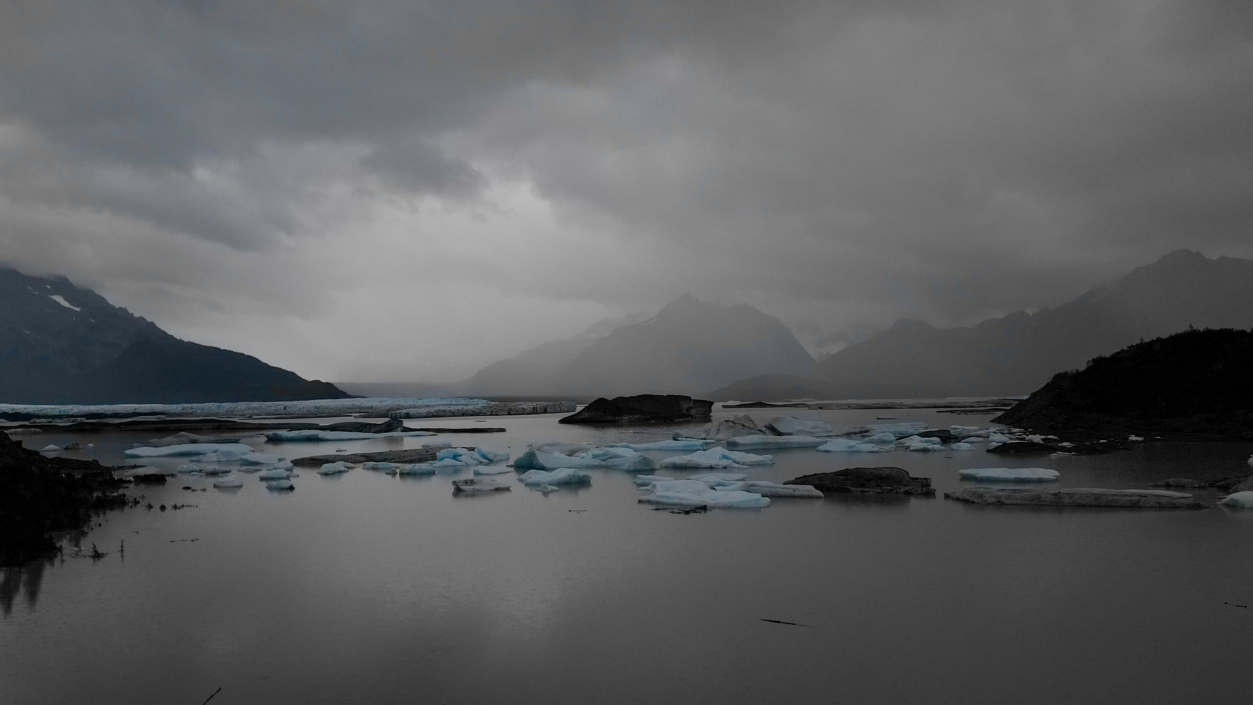 Landscape portrait of Sheridan Glacier on a cloudy day.