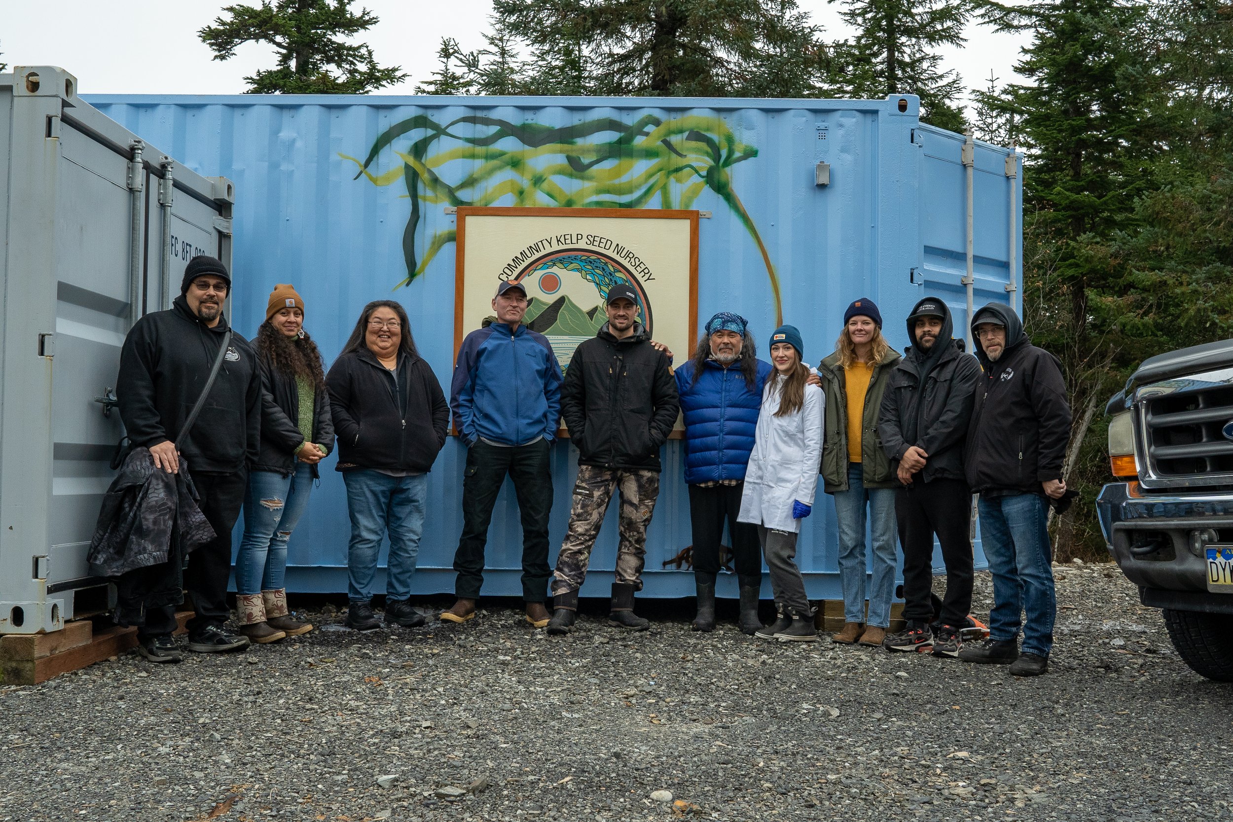 Members of Native Conservancy and their kelp immersion training stand outside their community kelp seed nursery.