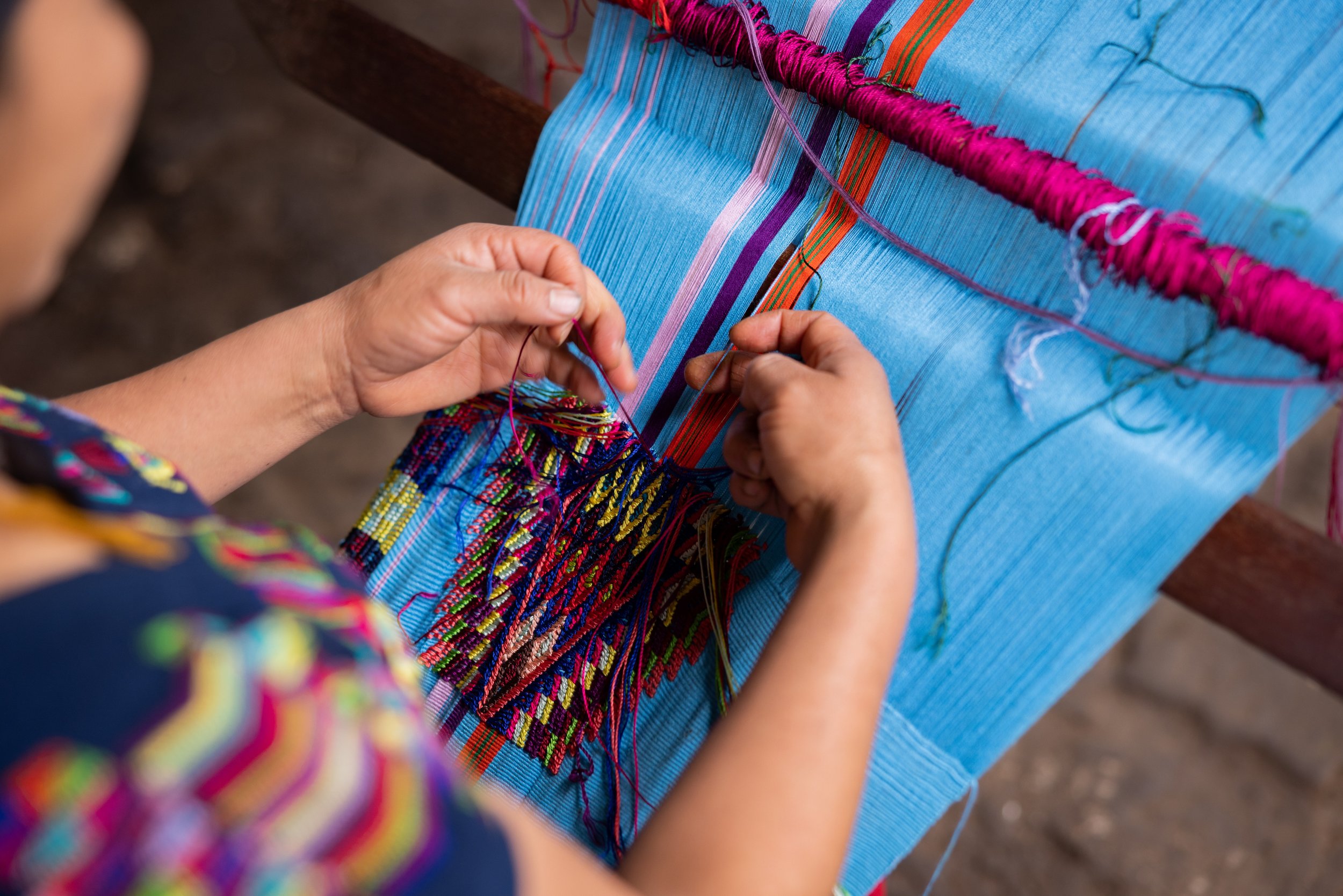 Rosellia weaving a traditional Maya huipil. As one of the fastest weavers in Chajul, she can typically make one of these tops in 20 days, working 5 hours each day.