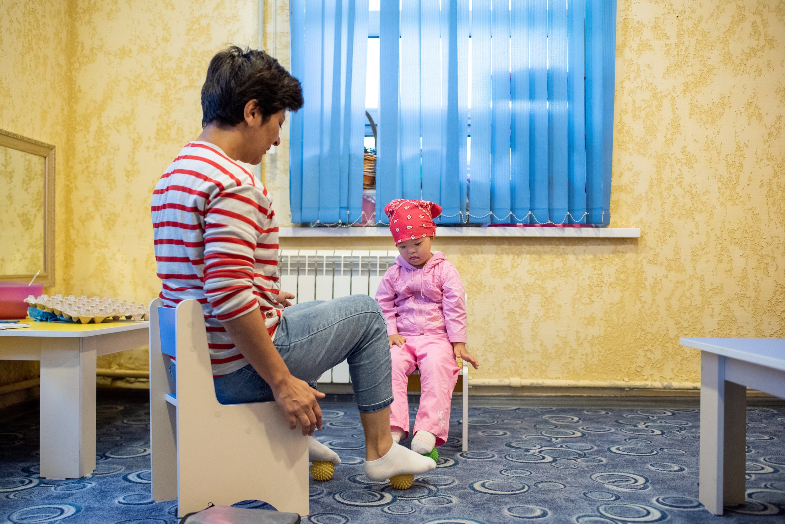 Fatima, age 4, developing her sensory skills.