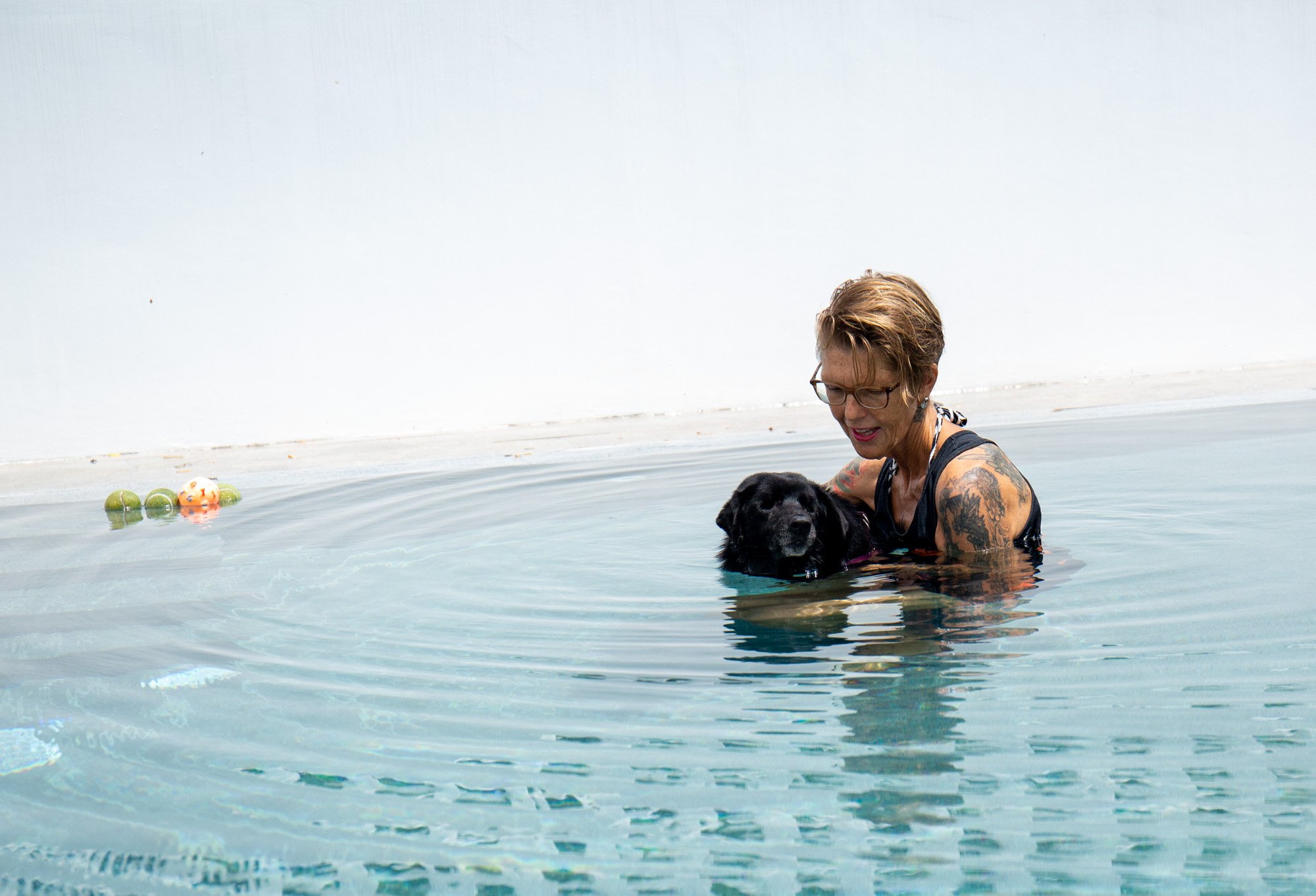 Diana treating an older dog in the pool at Soi Dog. Diana loves the older dogs and says that working in the pool gives them a short time to be pain-free.