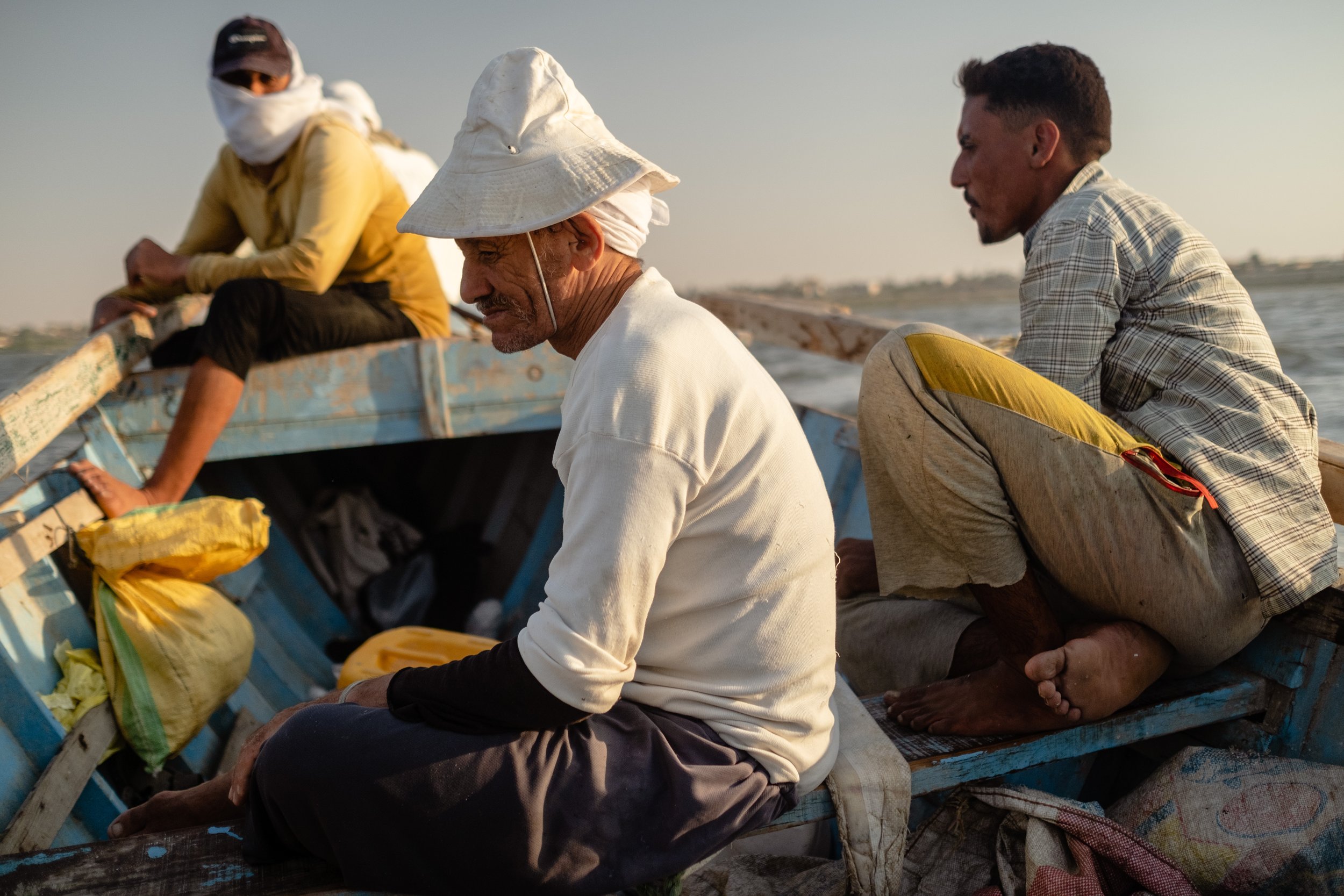 Fishermen take a rest after a long day in their boat in Lake Qarun. Fayoum, Egypt. September 09, 2022.