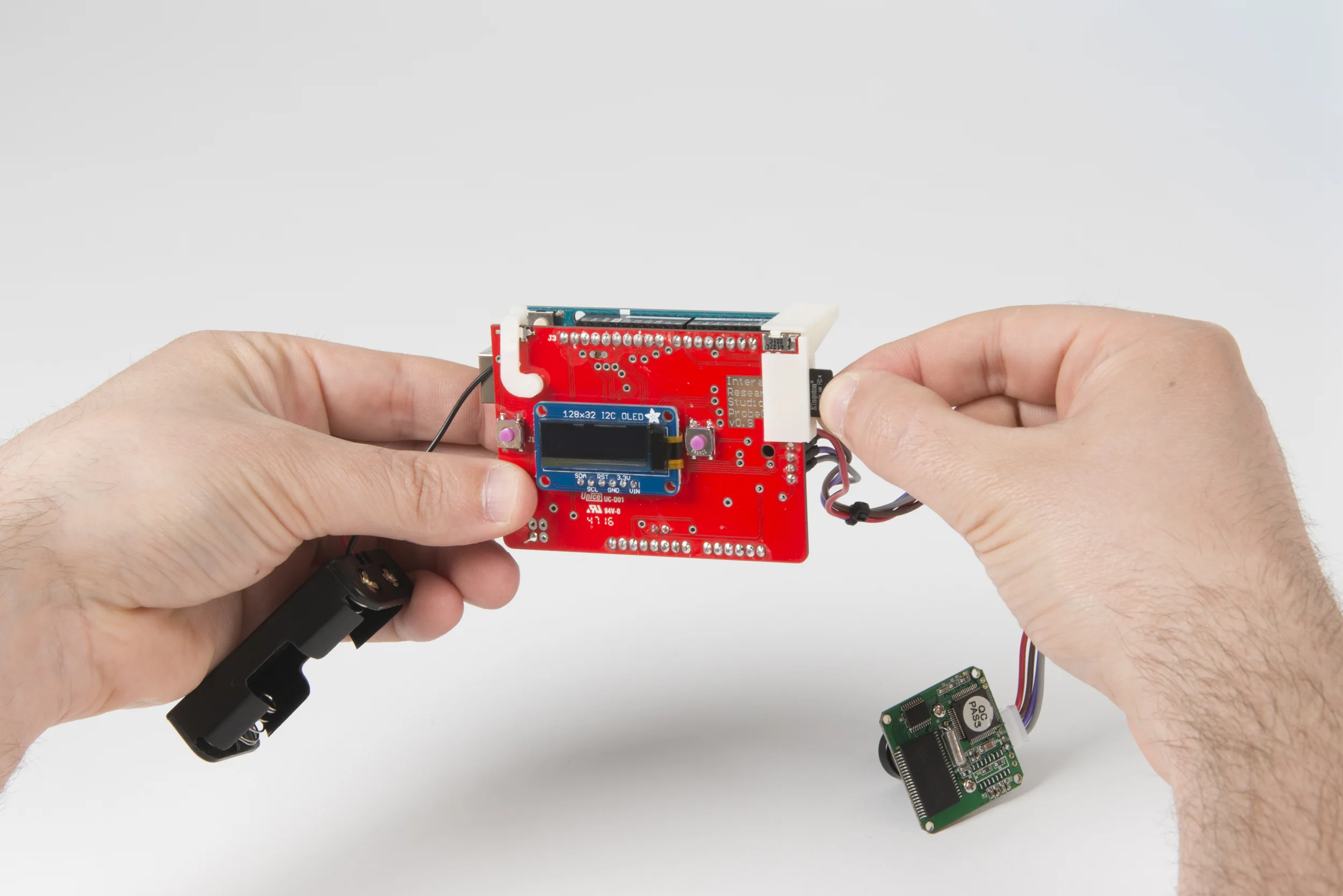Step 6 Plug the micro SD card into the shield. Unplug the Arduino’s USB cable and plug it back in. Once the camera starts up, you should be able to see your questions scroll across the screen.