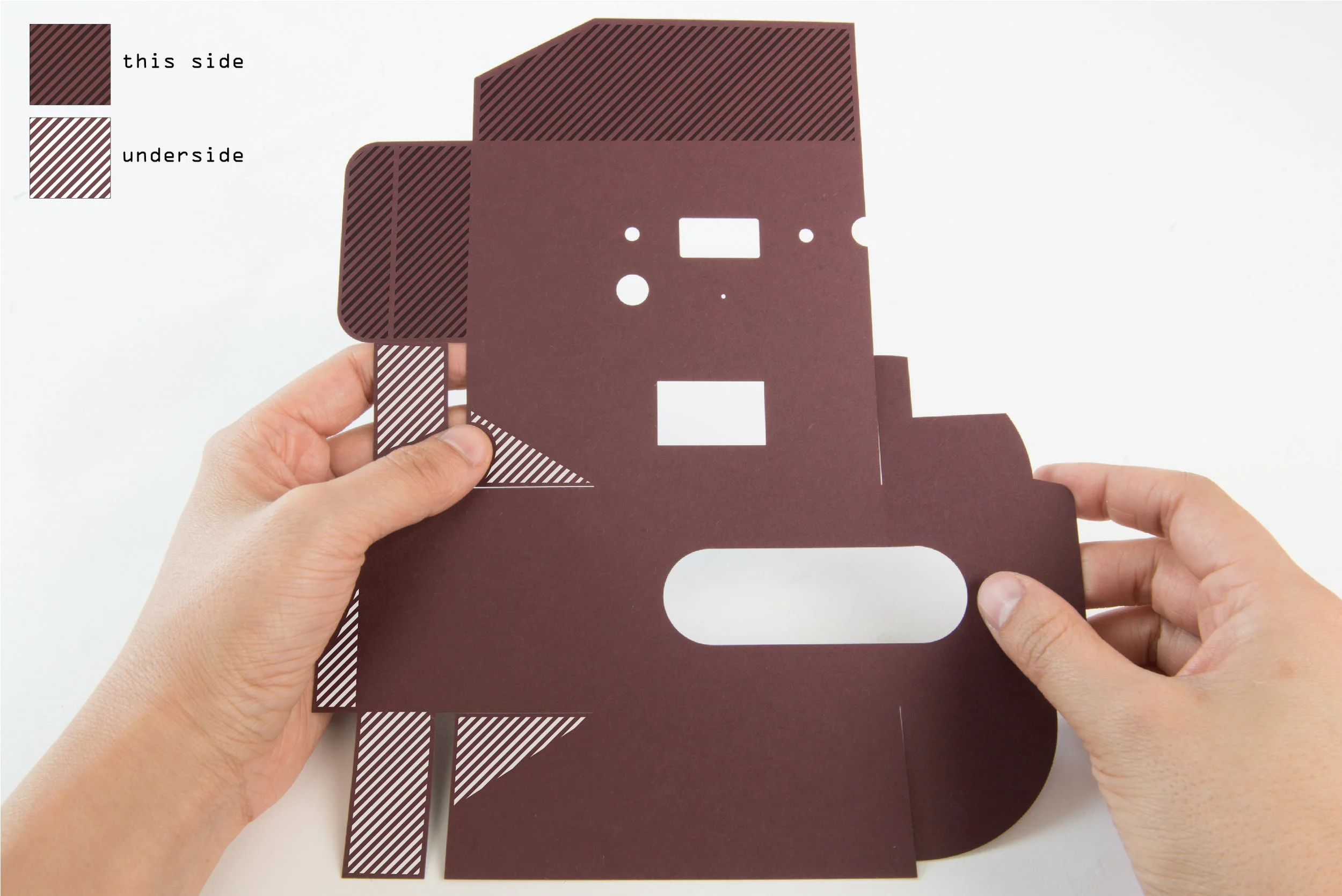 Step 22 Apply double-sided tape or glue to all the tabs on the cut card of the outer case.