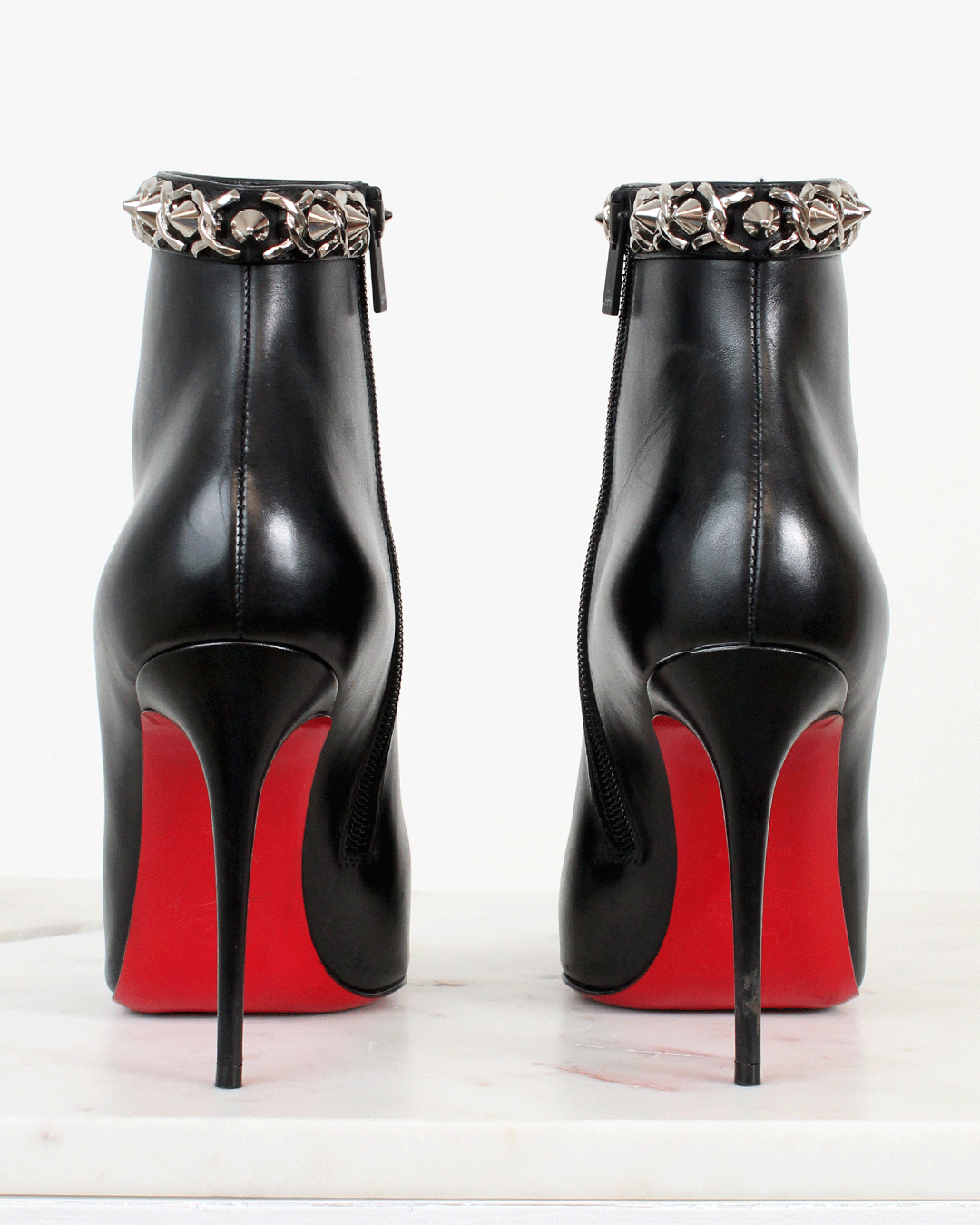 red bottom black boots