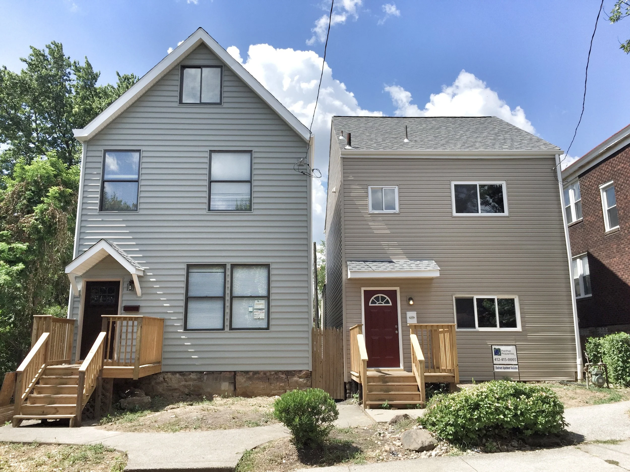 Side by side rental homes rebuilt after fire.