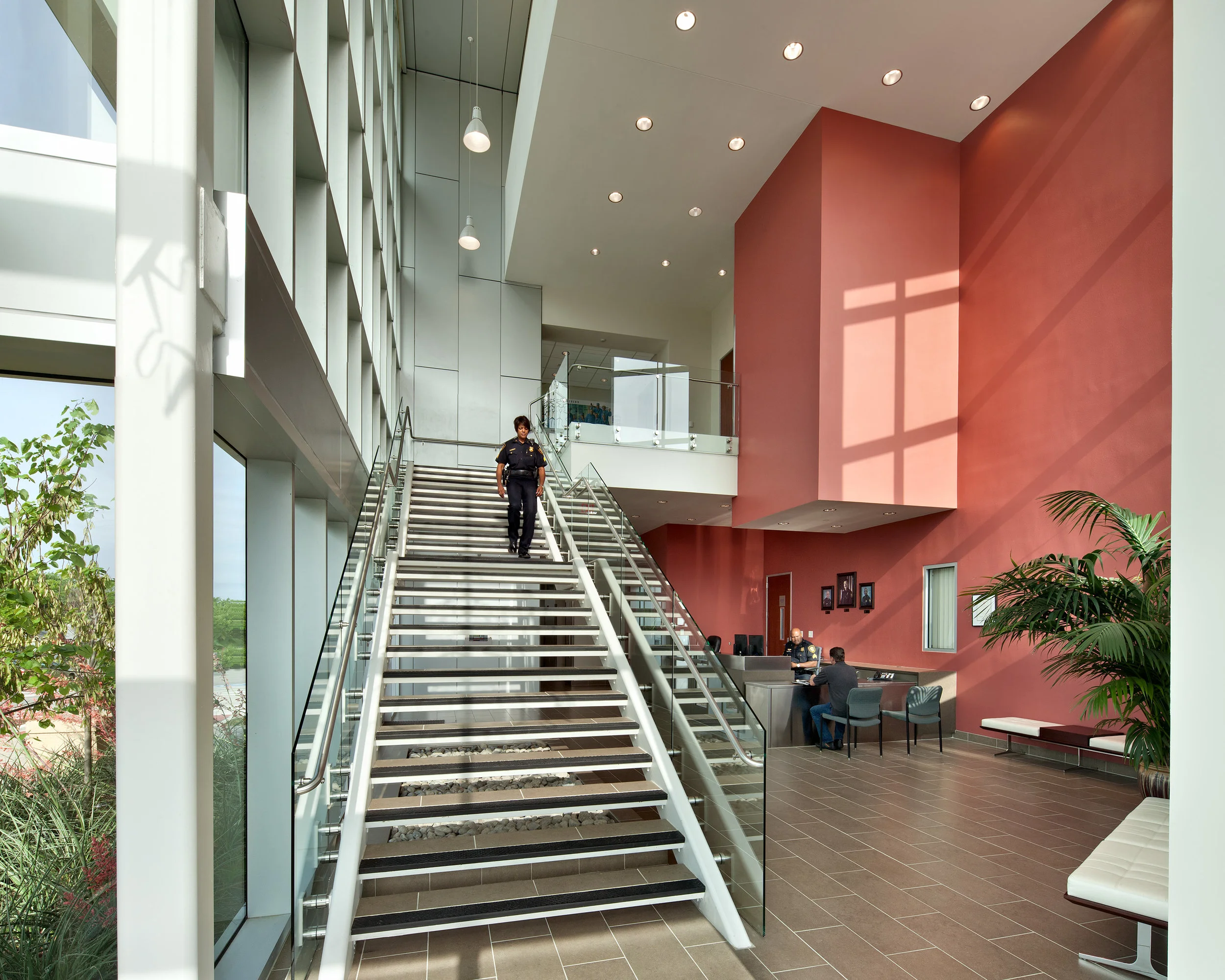 A soaring glazed “lantern” lobby celebrates community access to a large second-floor meeting room, directly engaging the street life below through a superscaled picture window.