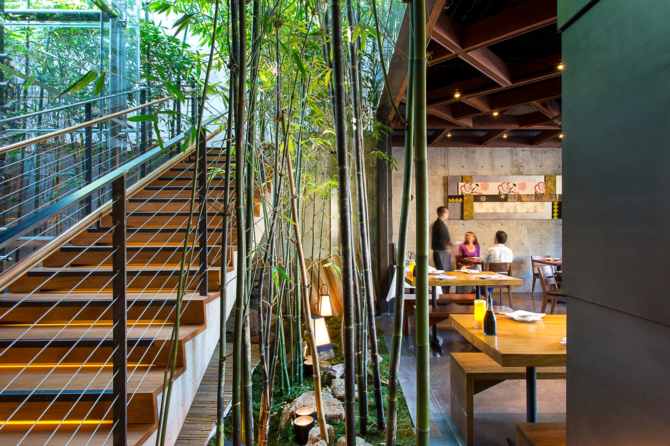 The dynamic dining area of the lower and upper levels are connected via a naturally lit bamboo garden.