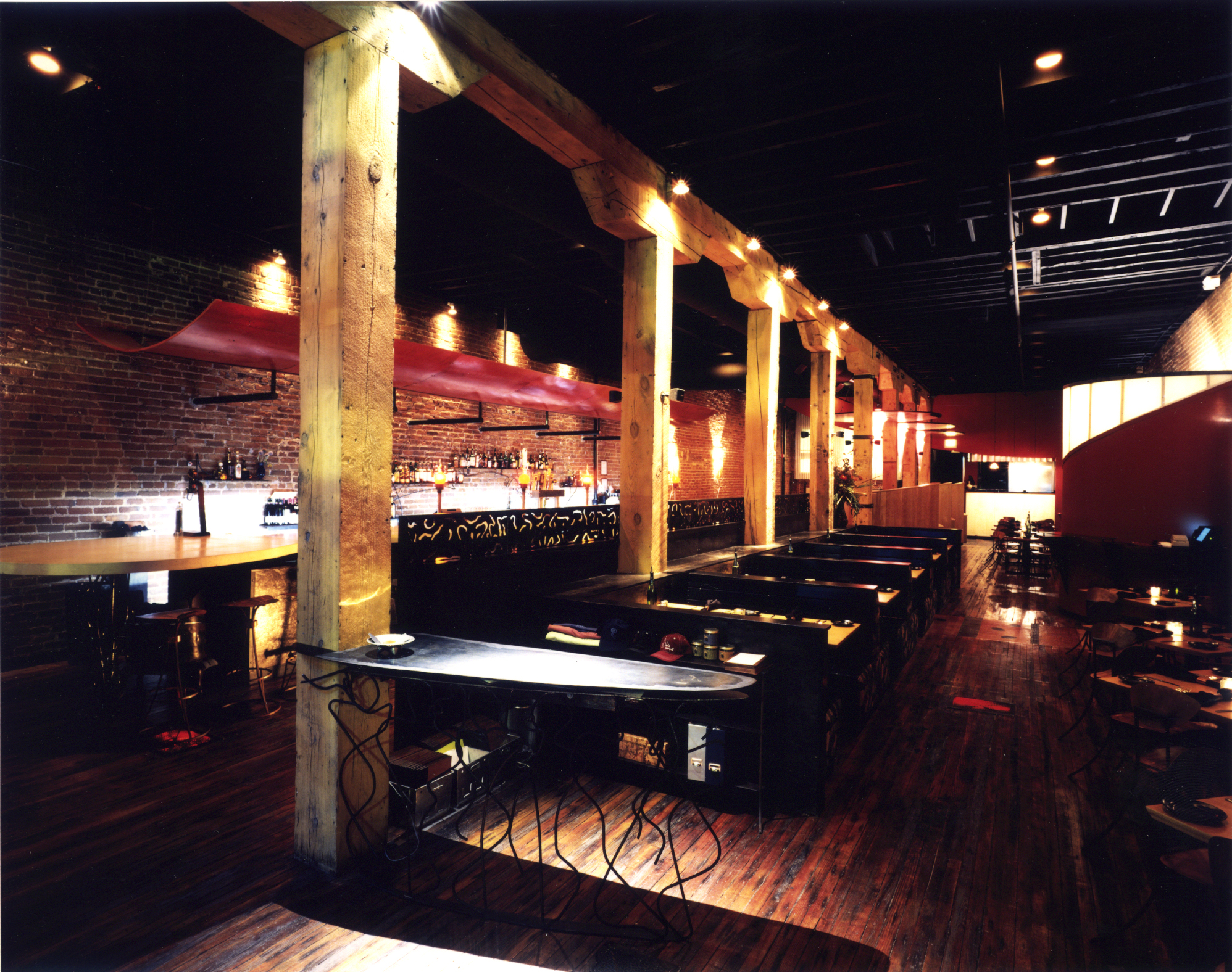 The grill/hearth is symbolic of Vesta and maintains a prominent position within the interior. It is visible from the entry, the bar and all tables within the dining room. 