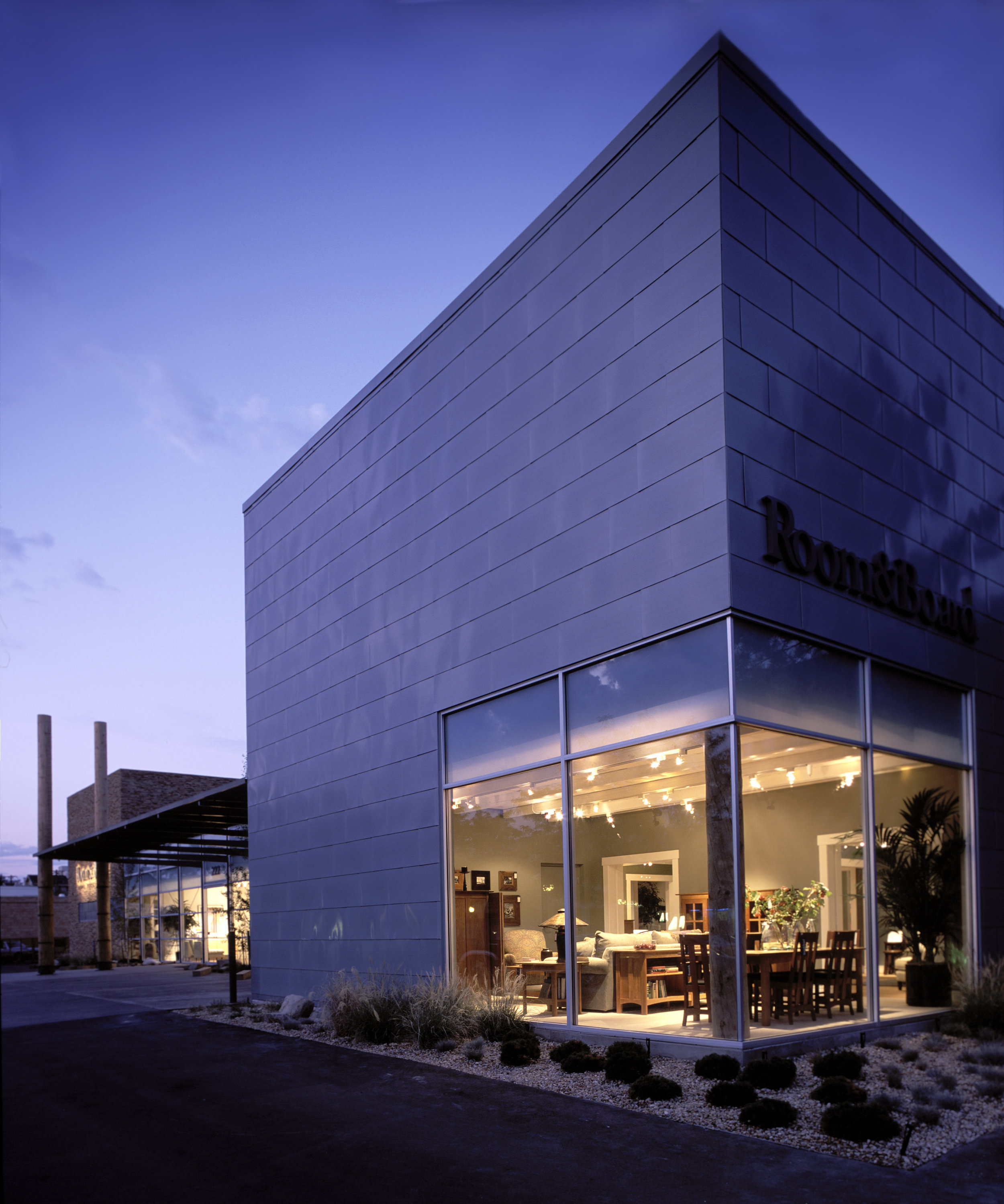 The existing structure was kept intact with the two volumes clad in stone at one end and zinc fluoride at the other end.