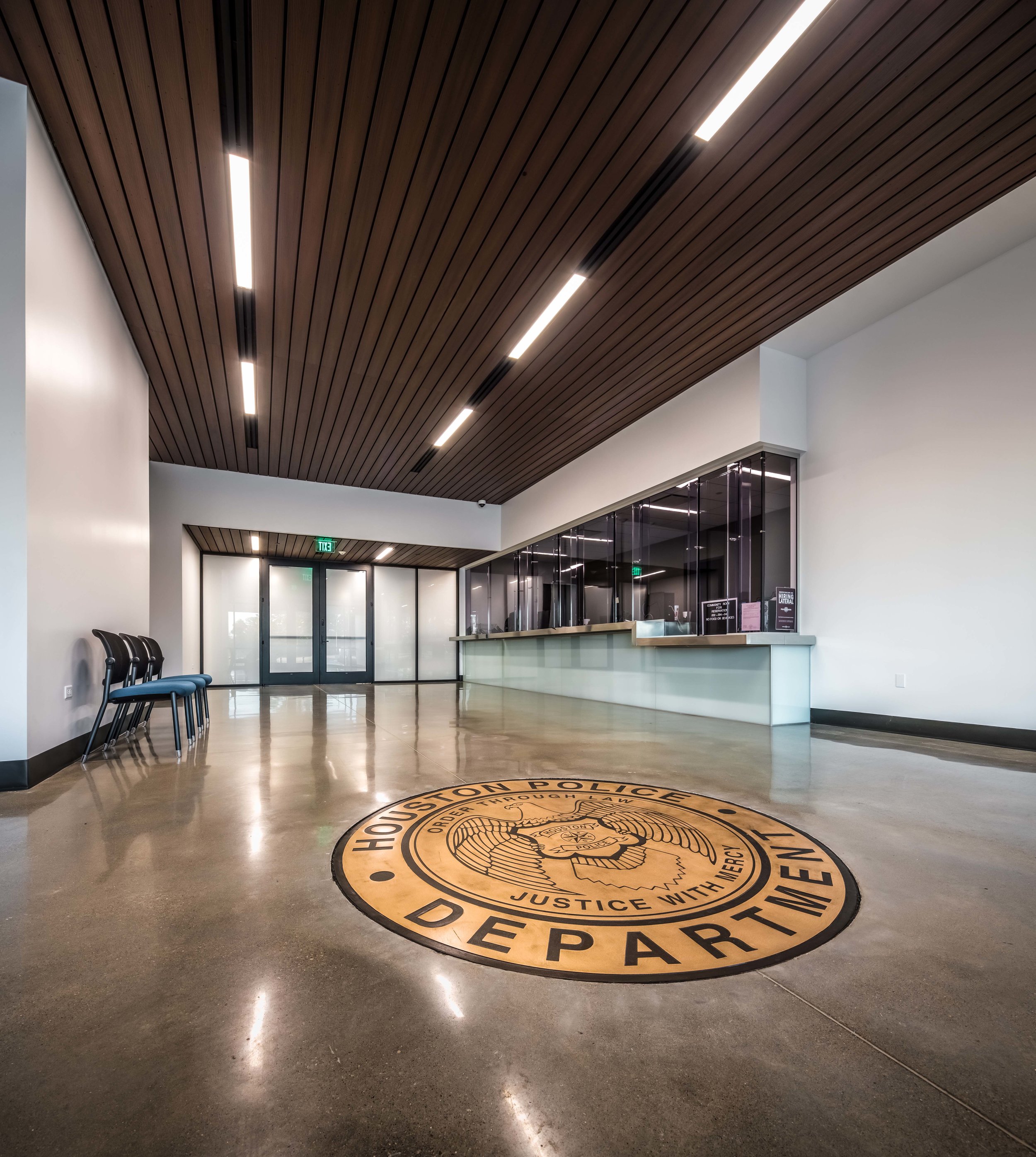 Areas available to the public, such as the lobby, front desk, and meeting room, are located along the south side of the building, nearest the park and public entrance to the site.
