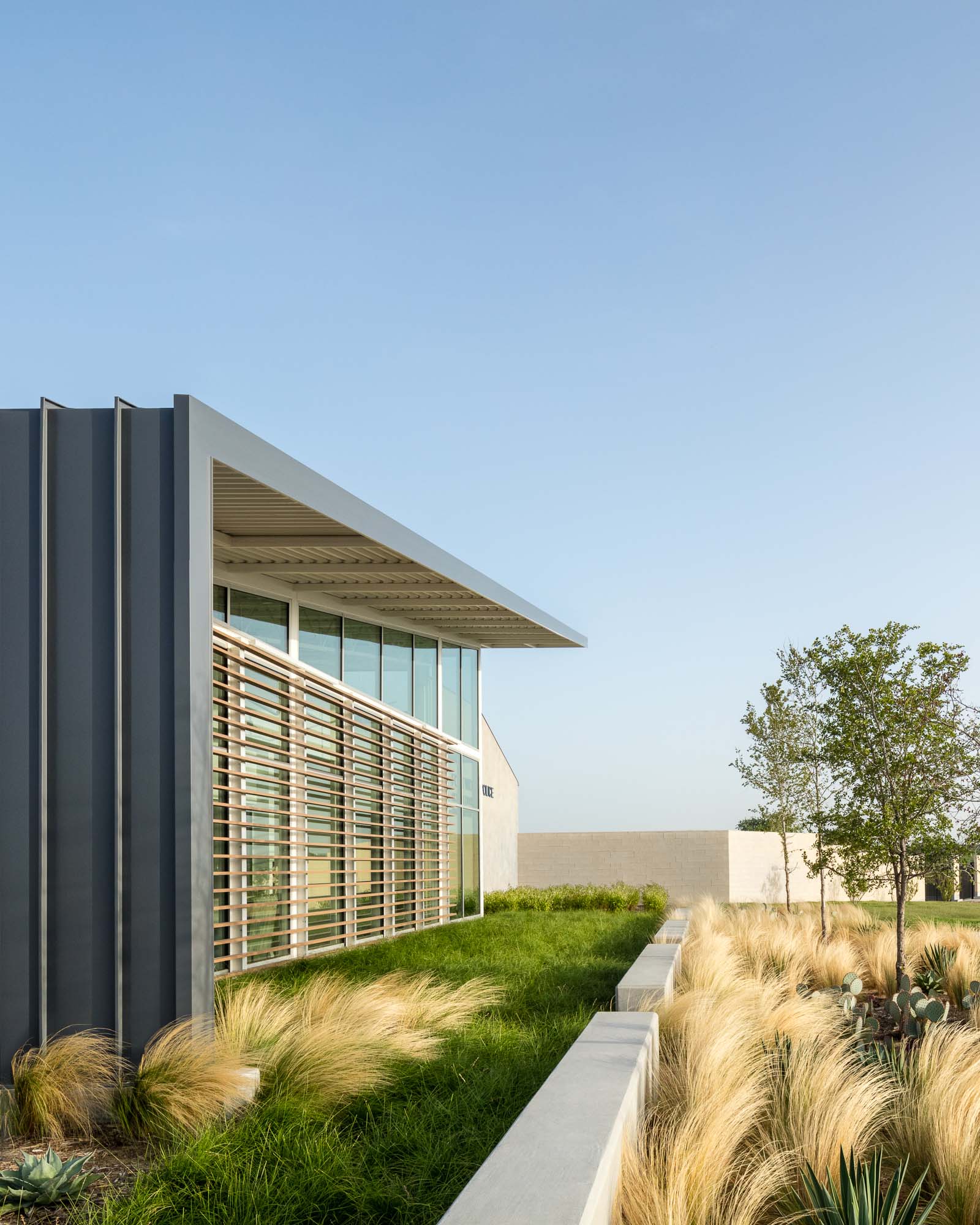 The exterior seamlessly integrates the facility into the north Forth Worth area, contextually, while still remaining immediately recognizable as a police station to the passerby.