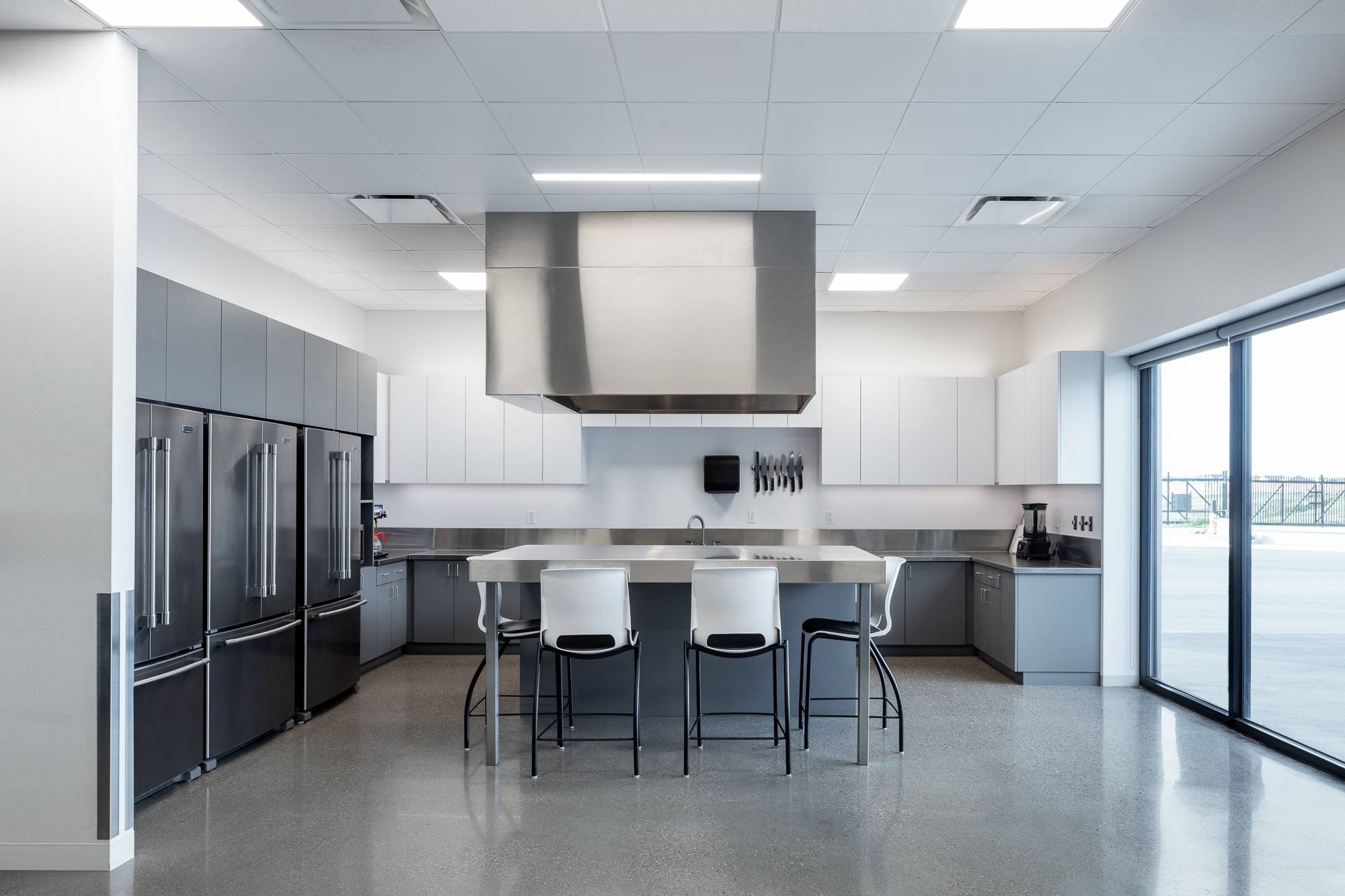 The interior features durable, minimalist, and timeless materials to create an elegant simplicity.