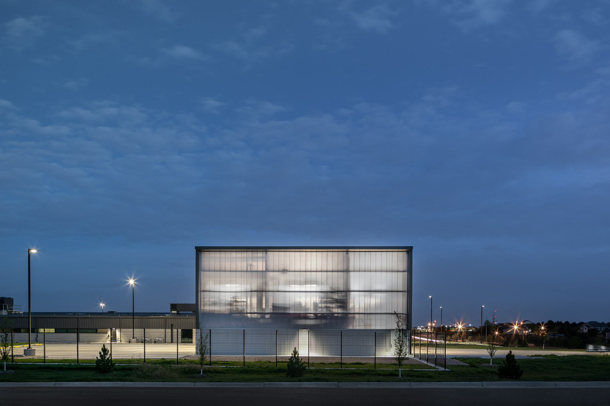 At night, the building transforms into a lantern, a symbol of the continued safety it provides to the surrounding community.