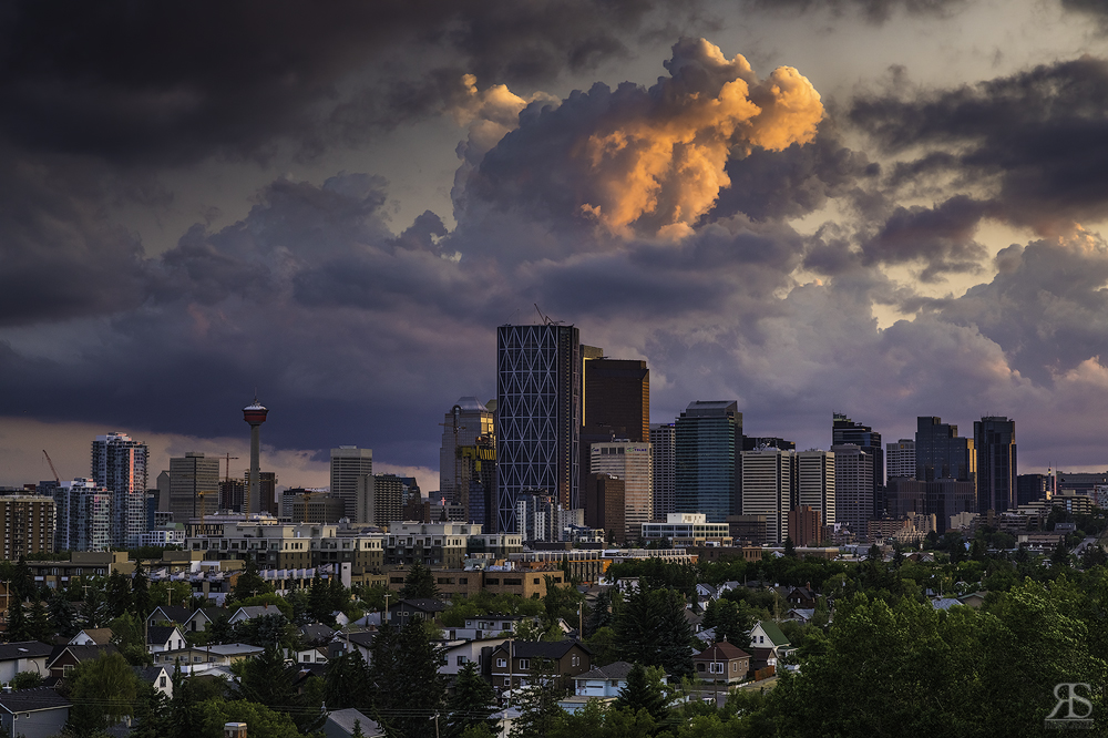 Big city. Big sky. Pay close attention to straight vertical lines and a level horizon.