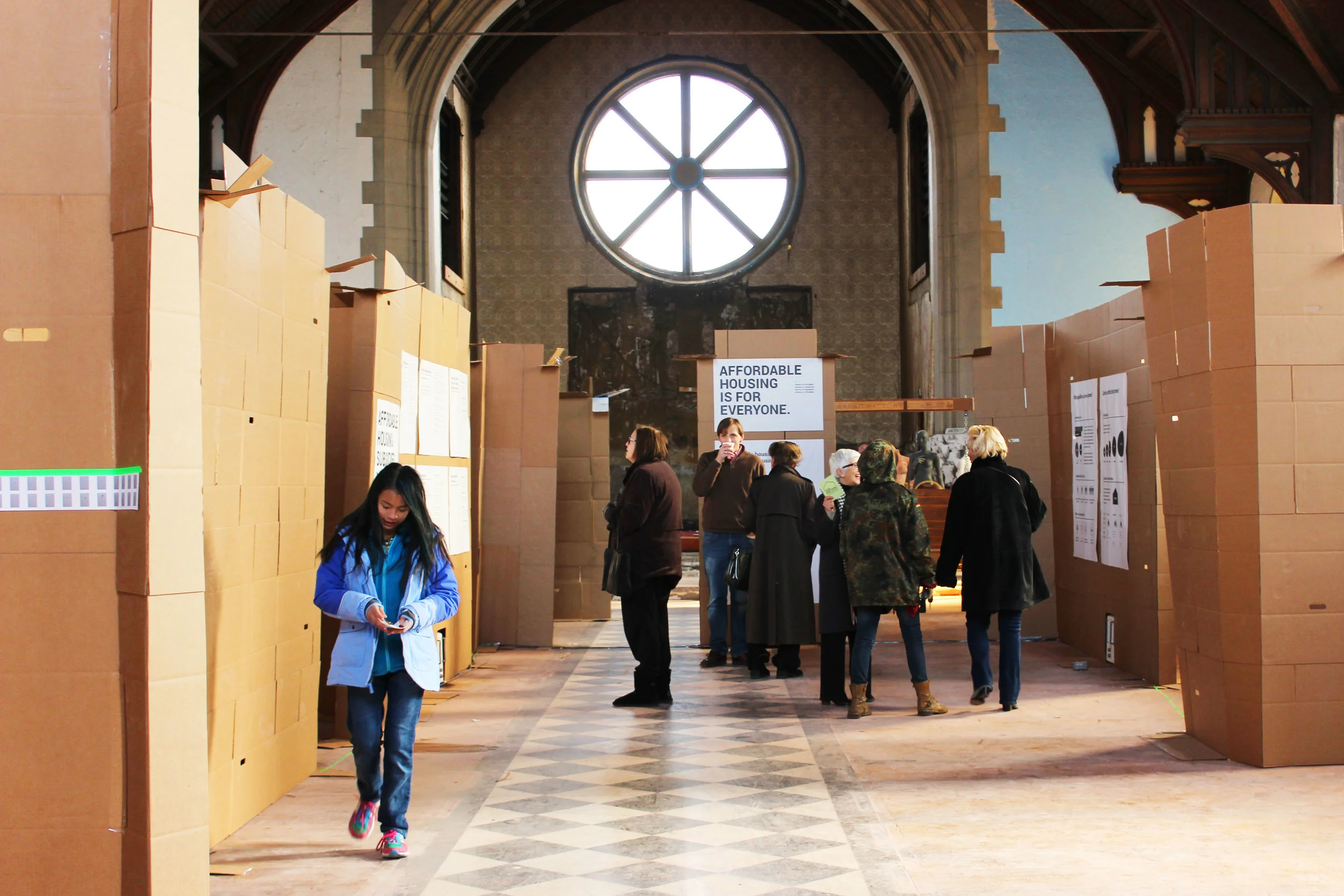 Above: Cooper's card board exhibitions, in process. Affordable? Yes. Housing? Not quite.