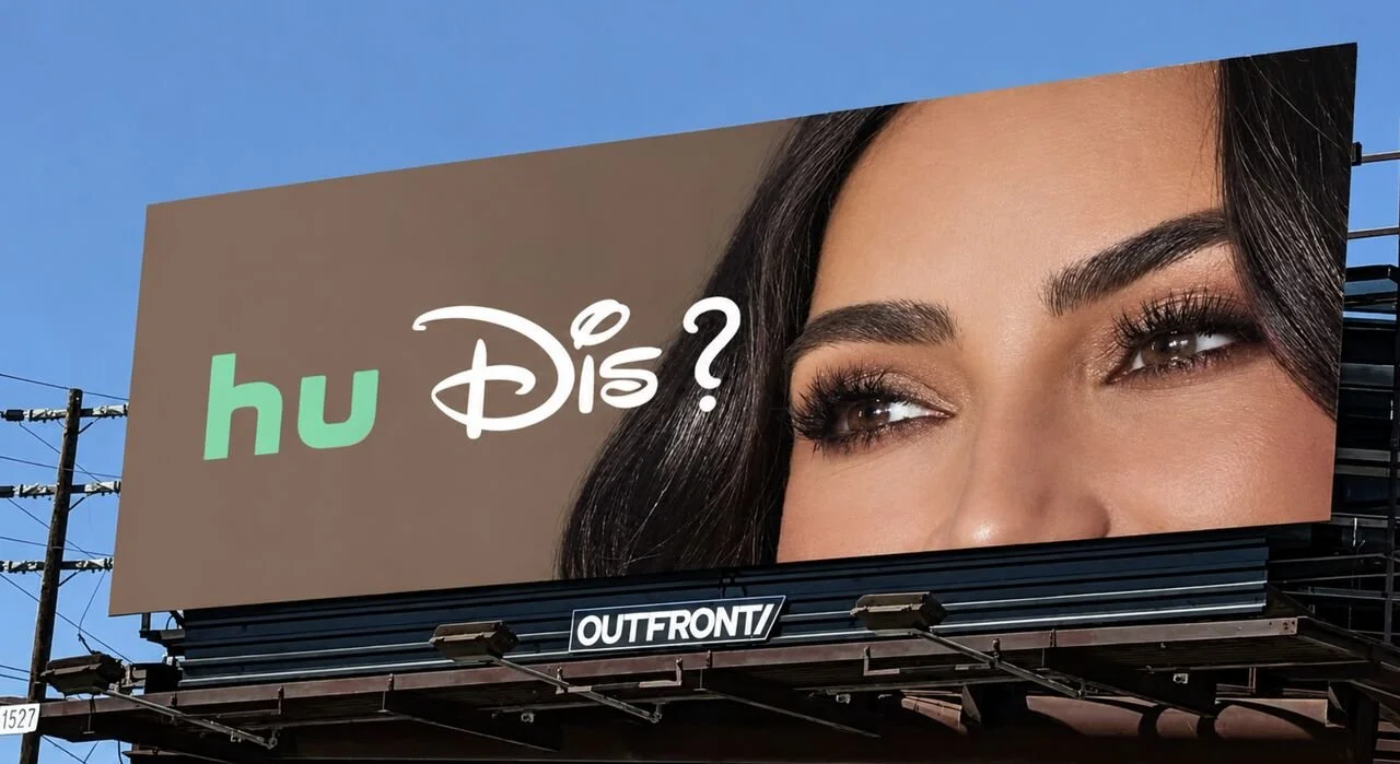 A billboard pairing Hulu’s green “hu” with Disney’s script “Dis” to read “hu Dis?”, beside a close-up of a woman’s eyes