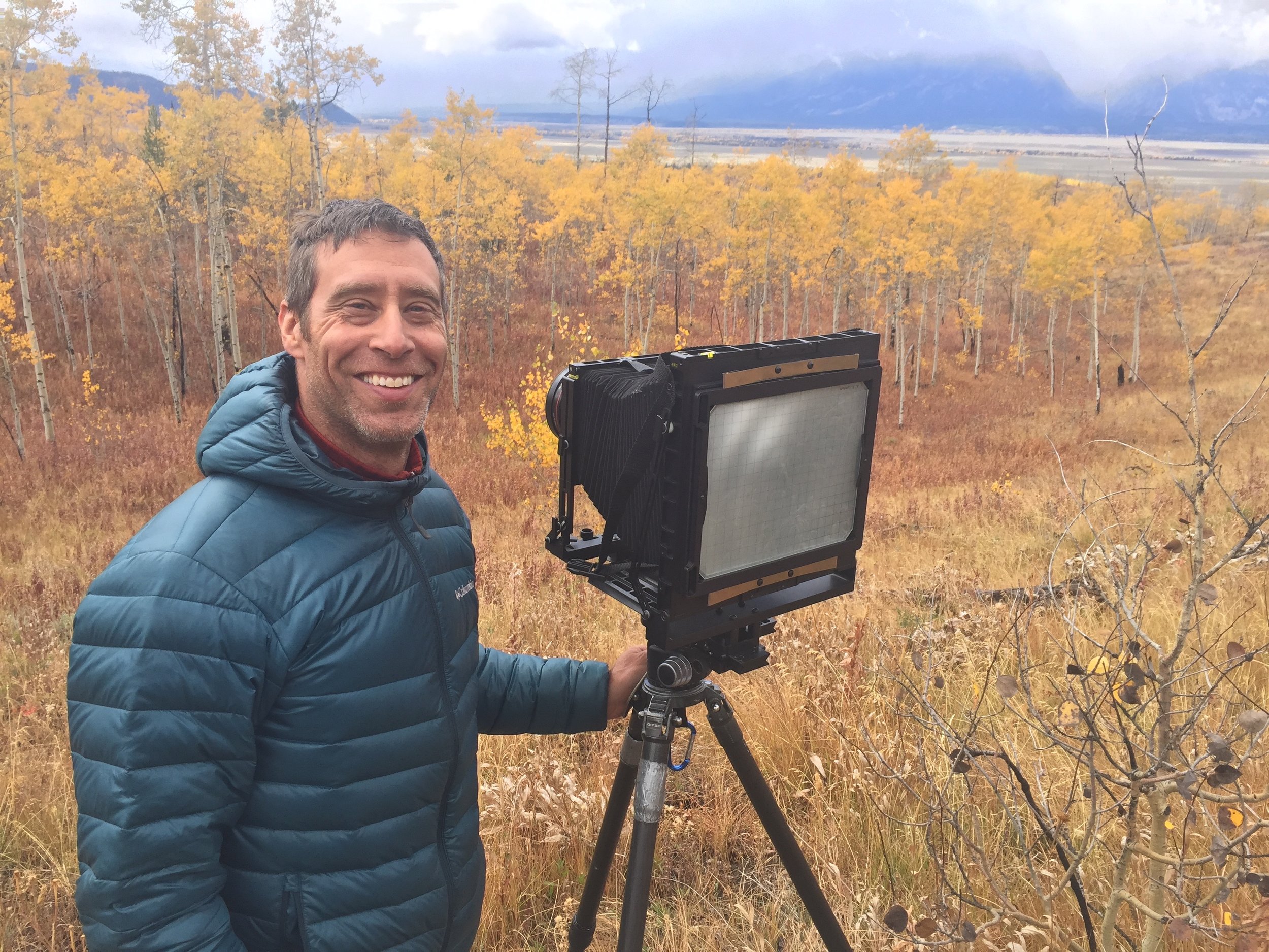 Jon Paul with his 8x10 film camera, enjoying his time in the field. Grand Teton National Park, Wyoming. Photo by Noah Paul