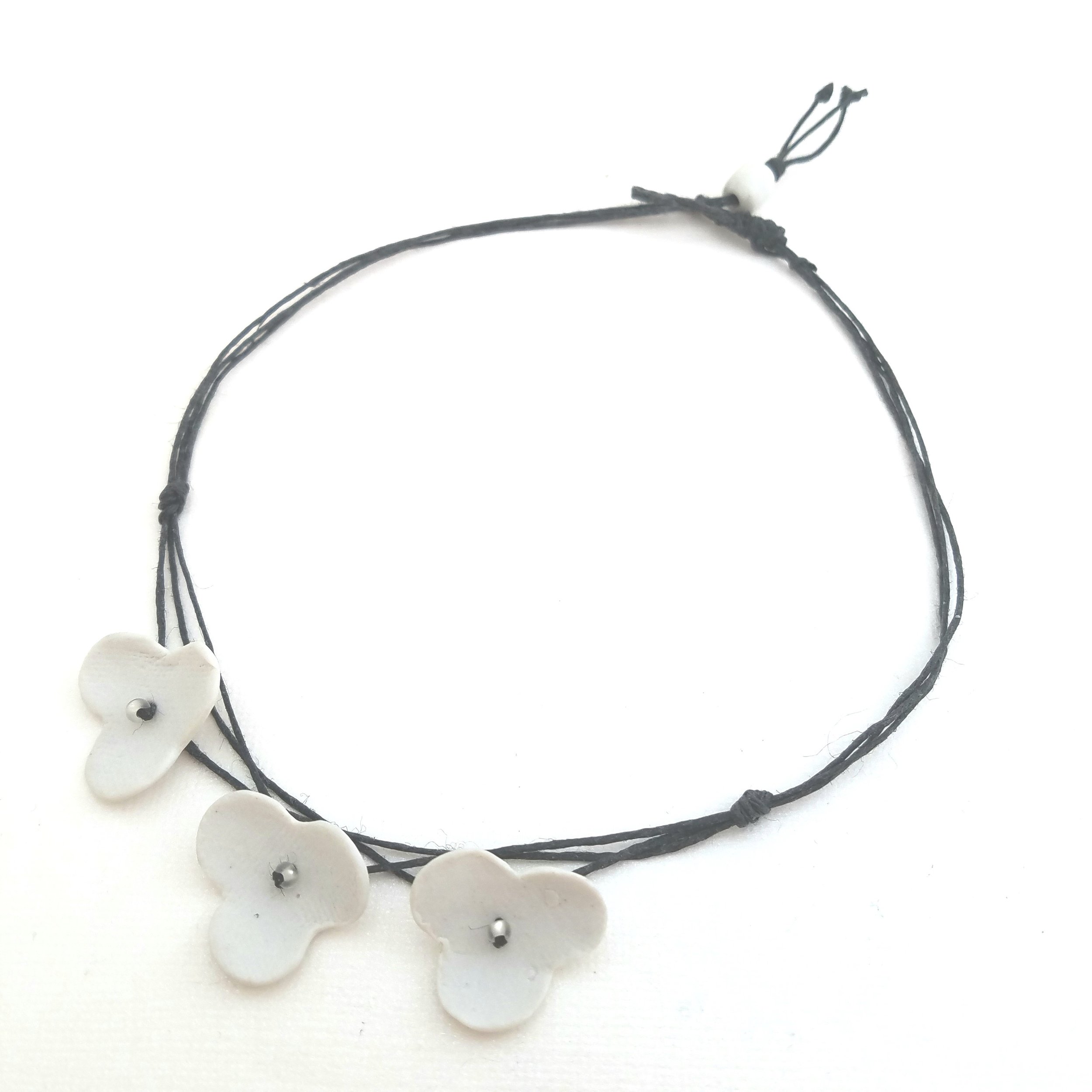 3 white porcelain flowers necklace.jpg