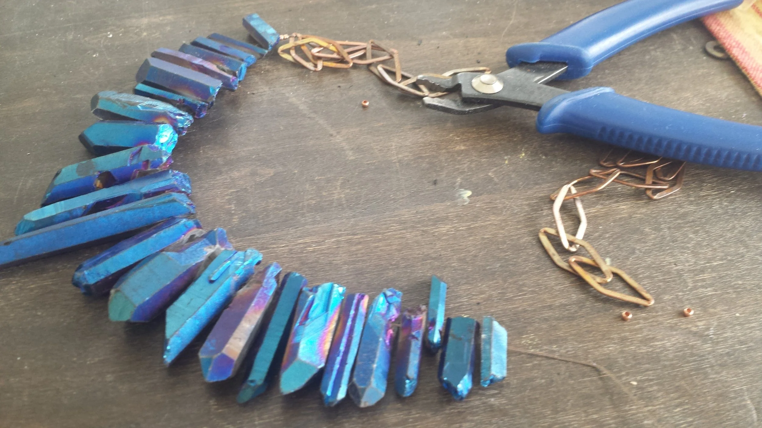 stringing quartz and attaching brass chain