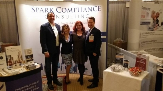 Spark Compliance's Ramsey Kazem, Diana Trevley, Kristy Grant-Hart and Jonathan Grant-Hart at the exhibition space, Compliance and Ethics Institute, Las Vegas, 2017.