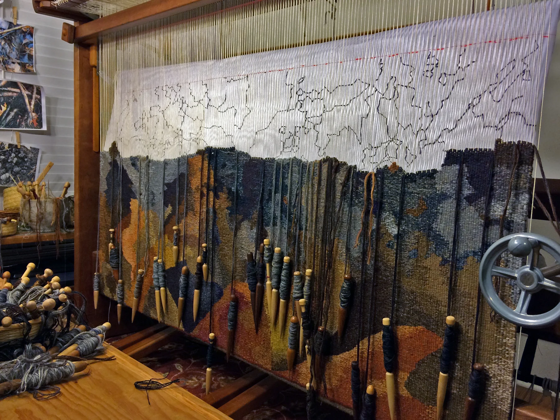 This tapestry is about the wildfires that swept through areas of the Southeast in the United States in late 2016. Thousands of acres of wooded land were burned and at least fourteen people lost their lives. Many more lost their homes and businesses in some of the most devastating of the fires in the Great Smoky Mountains of Tennessee.