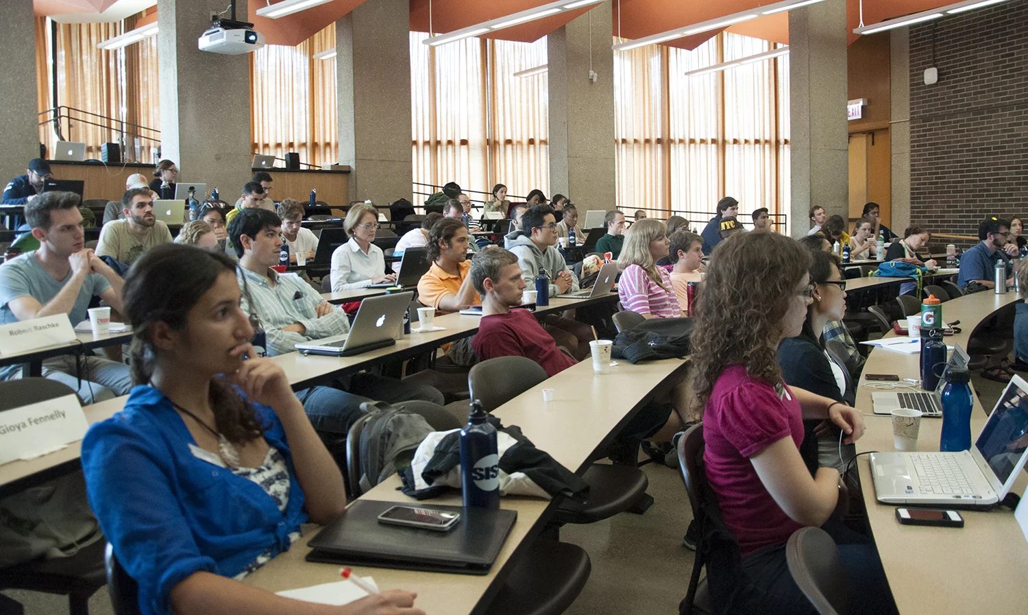 2013 SISE'ers deep in thought (or possibly Facebook'ing) during a lecture.
