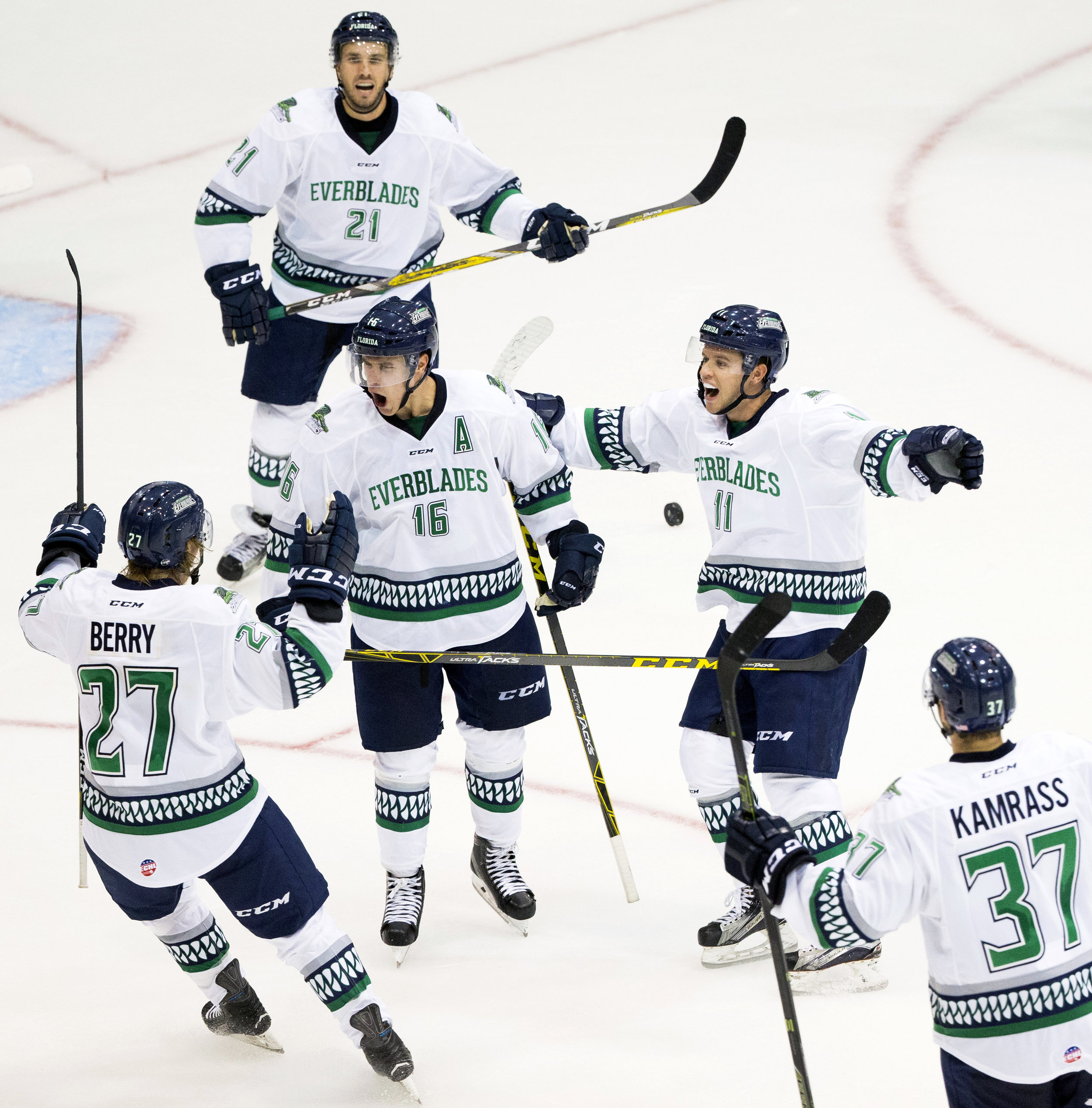  Florida Everblades' players celebrate with Mike Aviani (16) after Aviani scored the game-tying goal with 59 seconds left in the third period of action at Germain Arena Friday, October 14, 2016 in Estero, Fla. The Everblades would score all of their 