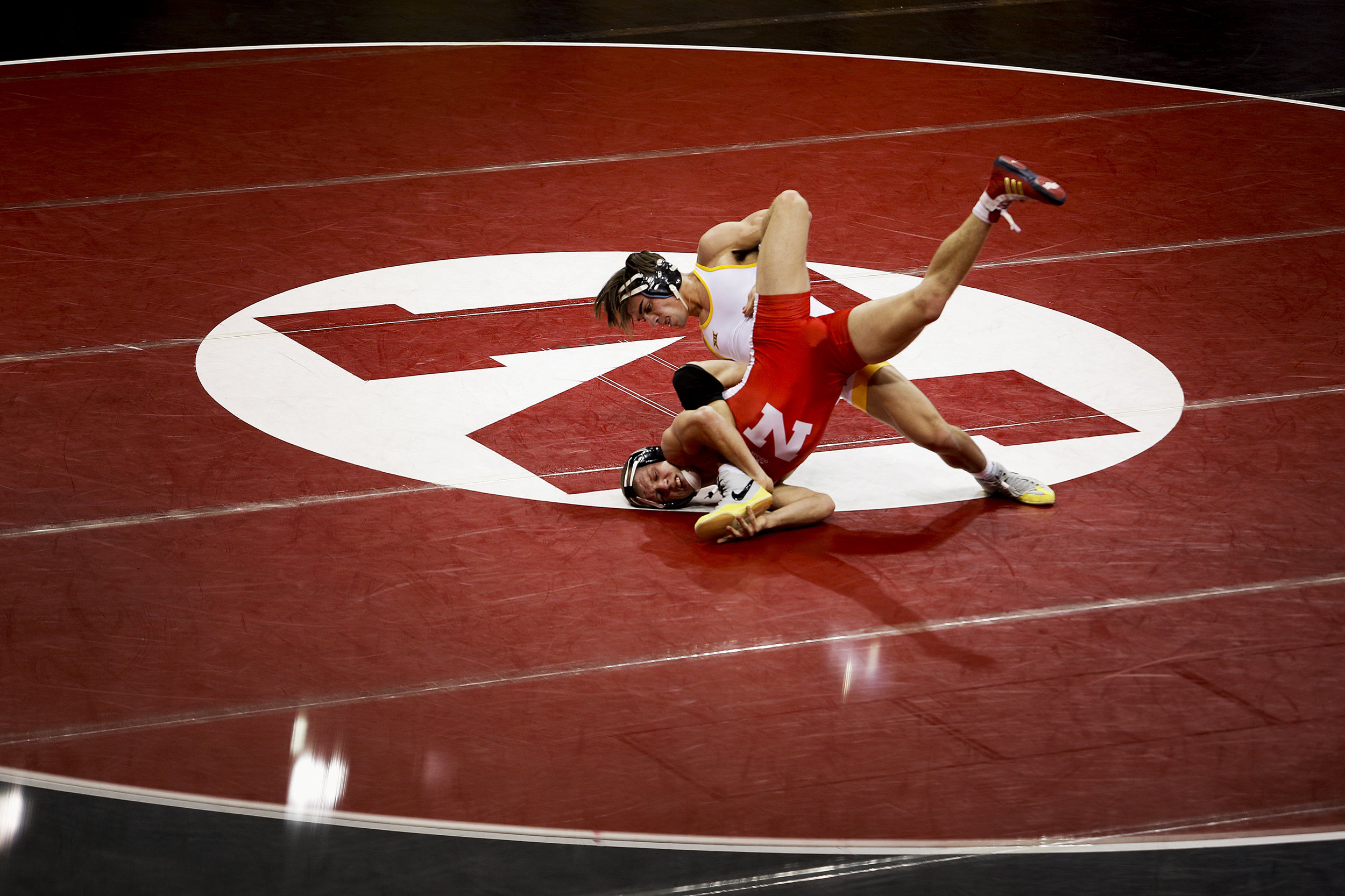  Nebraska's Anthony Abidin (red) is forced to the mat by Wyoming's Bryce Meredith (white) during their match at Devaney Sports Complex Saturday November 21, 2015 in Lincoln, Nebraska. Meredith would defeat Abidin 12-3 but represented the only Wyoming