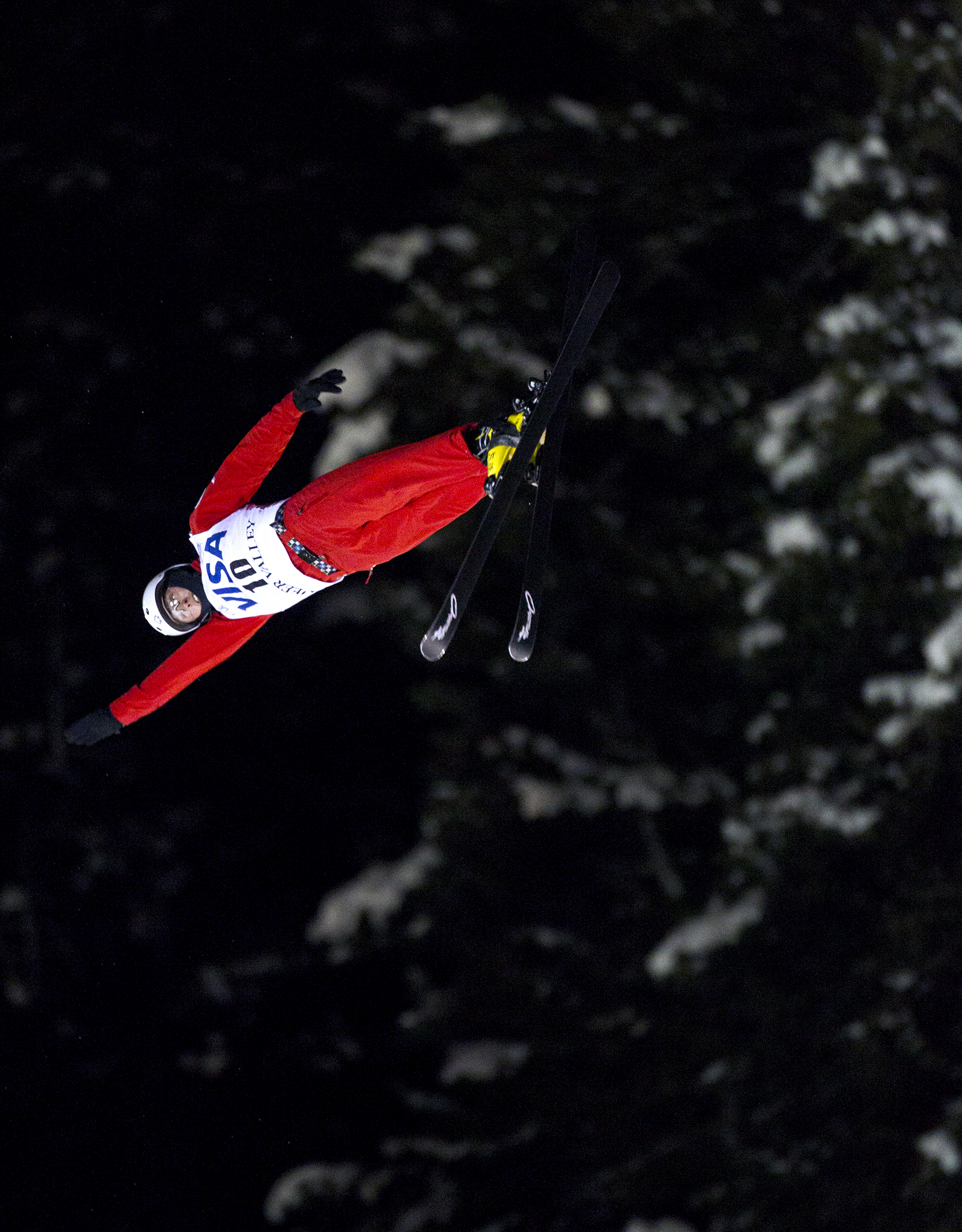  Petr Medulich of Russia extends his arm during his second and final jump in the men's finals of the Visa Freestyle International Aerials World Cup at Deer Valley Resort Friday, Feb. 5, 2016 in Park City, Utah. The jump registered a score of 128.05 w