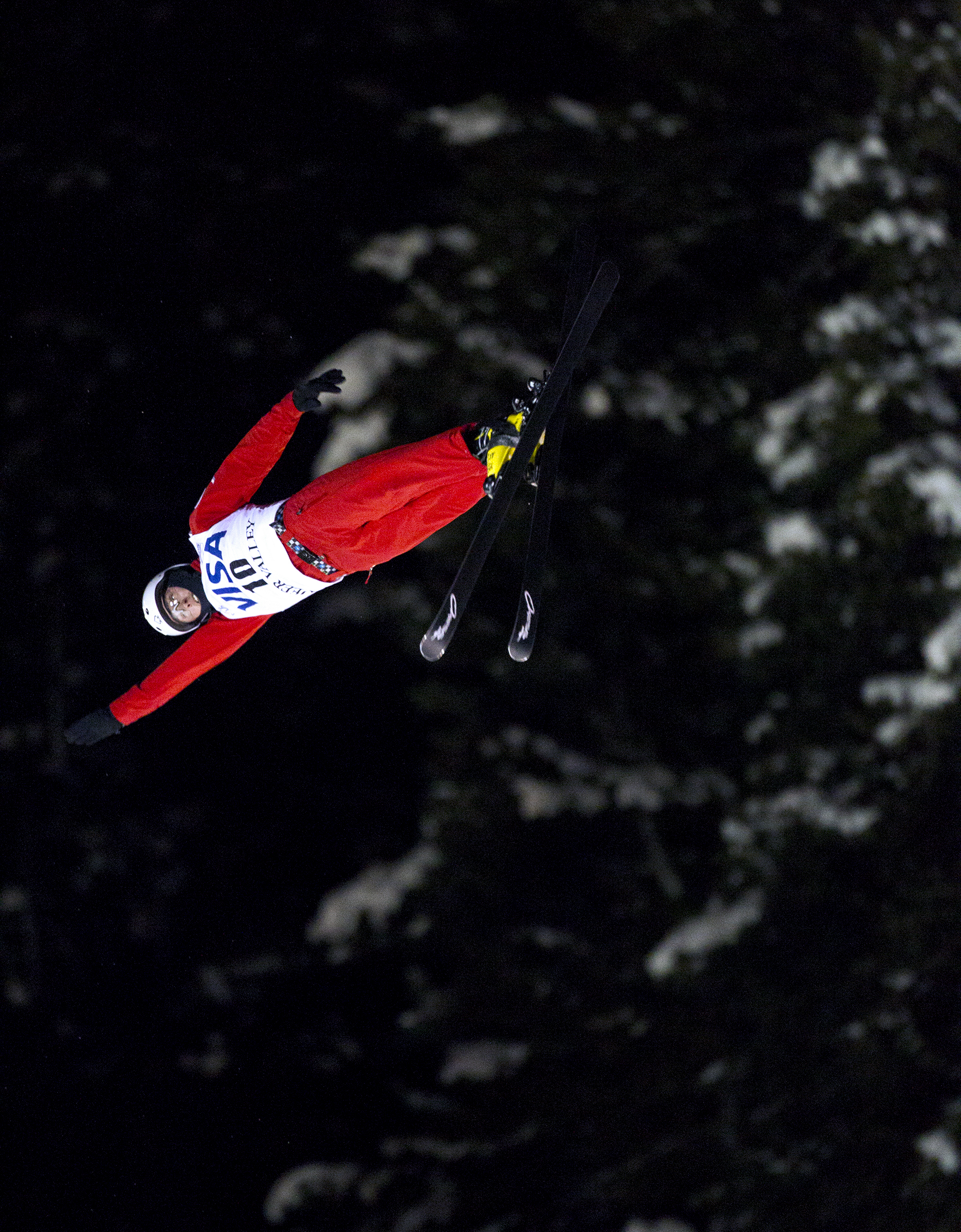Petr Medulich of Russia extends his arm during his second and final jump in the men's finals of the Visa Freestyle International Aerials World Cup at Deer Valley Resort Friday, Feb. 5, 2016 in Park City, Utah. The jump registered a score of 128.05 with the judges and would solidify Medulich first place in the event and would propel him to first overall in the world. 