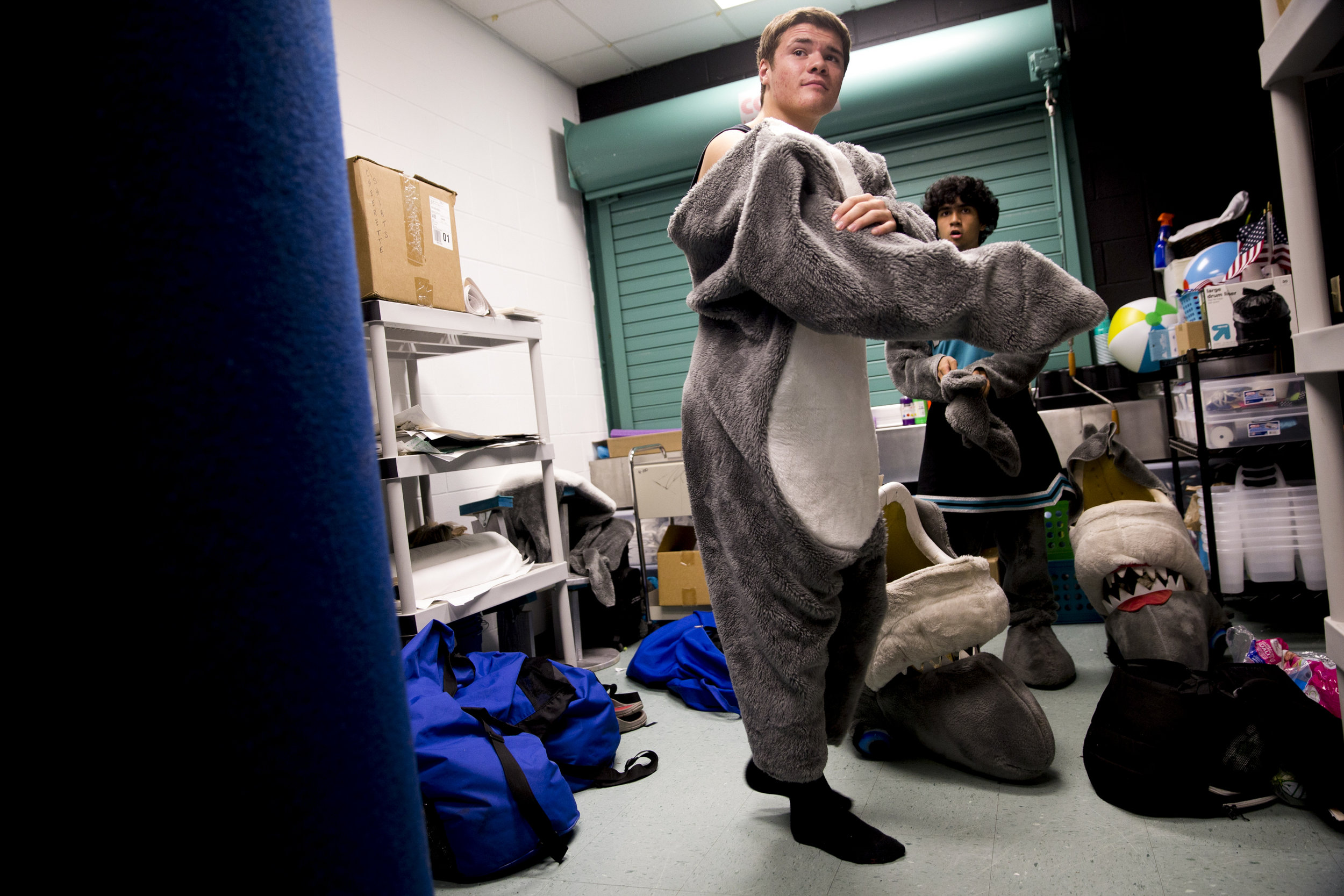  Gulf Coast High School juniors Dylan Spelman, 16, left, and Matthew Masin, 17, adorn the costumes for the school's mascots Sharkey and Sharkette, respectively, prior to a football game against Hialeah High School Friday, September 2, 2016 at Gulf Co