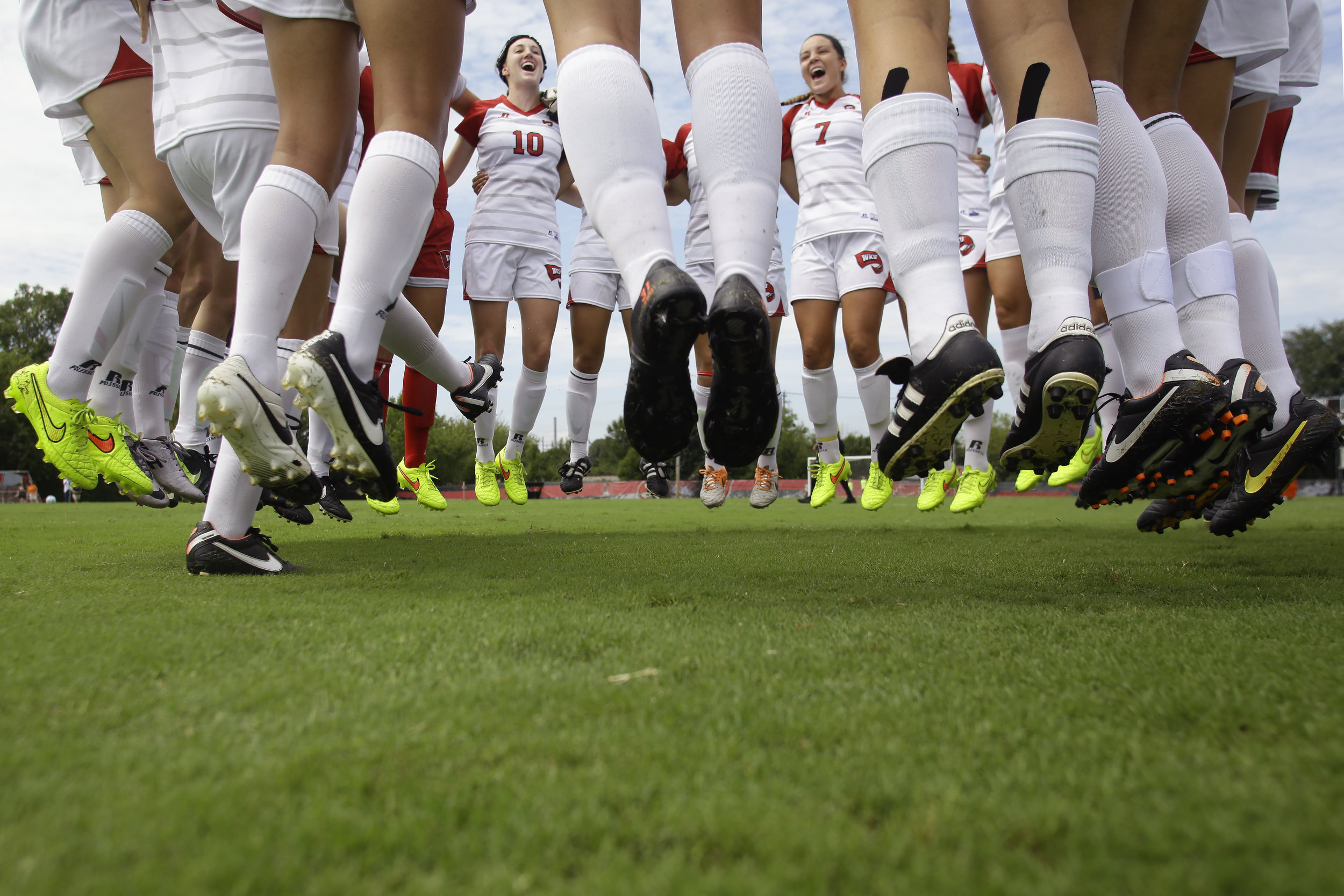  WKU freshman midfielder Sarah Gorham (10) and freshman goalkeeper Allison Leone (1) get pumped up with the rest of the WKU women's soccer team August 24, 2014 prior to their first home matchup against Mercer at the WKU Soccer Complex in Bowling Gree