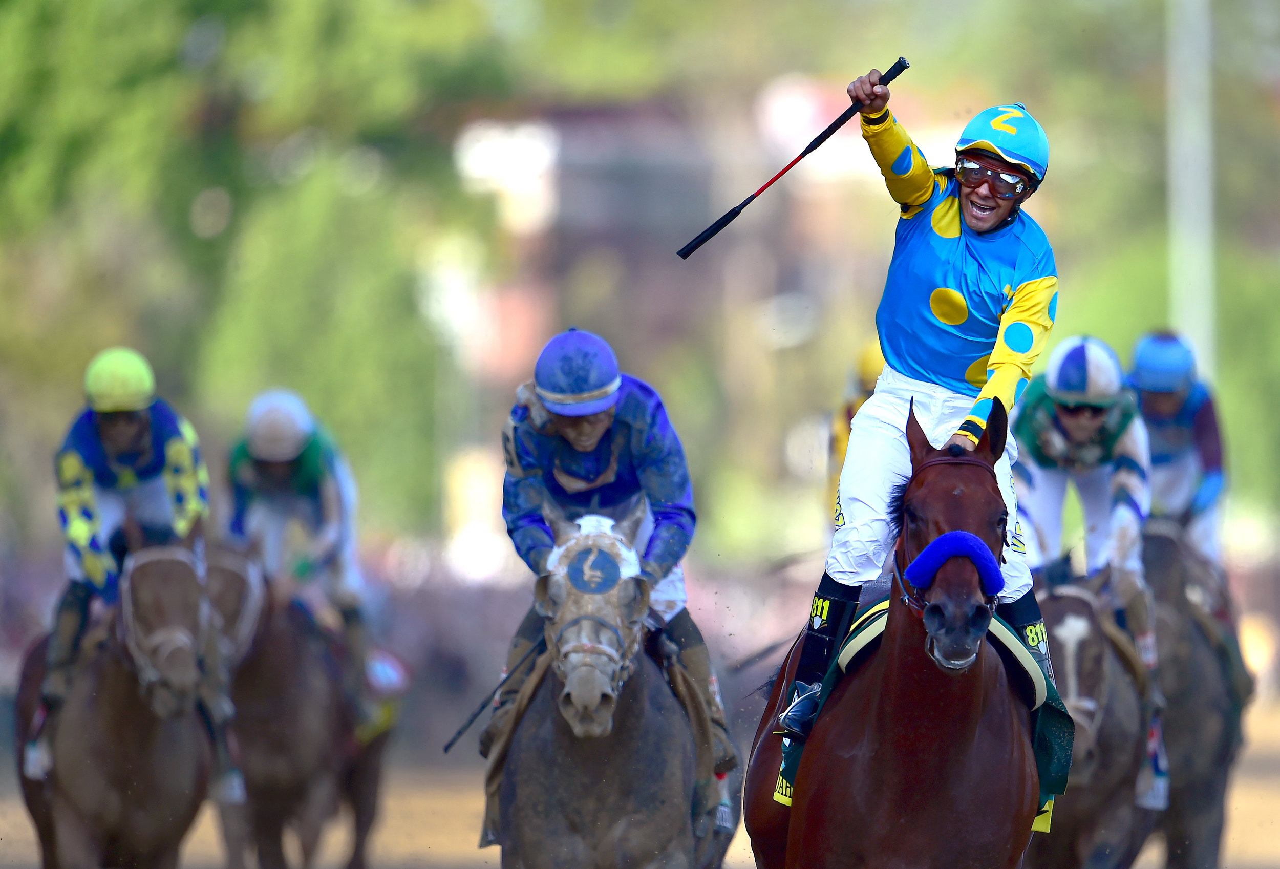  Jockey Victor Espinoza celebrates after crossing the finish line first aboard American Pharoah during the 141st running of the Kentucky Derby May 2, 2015 at Churchill Downs in Louisville, Ky. It would mark the second straight year Espinoza has won t