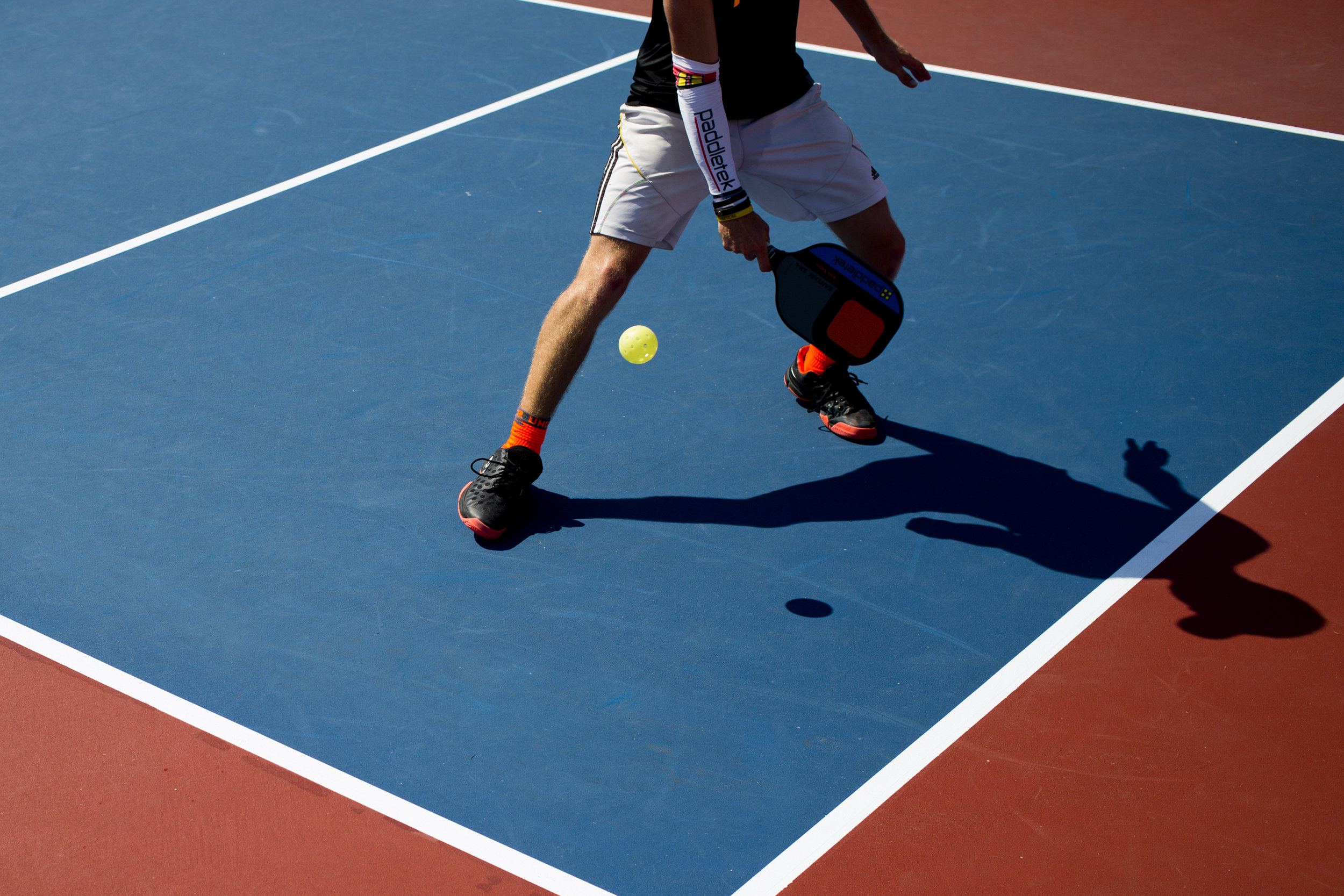  Kyle Yates hits the ball during the mixed doubles 19 and over championship match during the US Open Pickleball Championships at East Naples Community Park Thursday, April 28, 2016. 