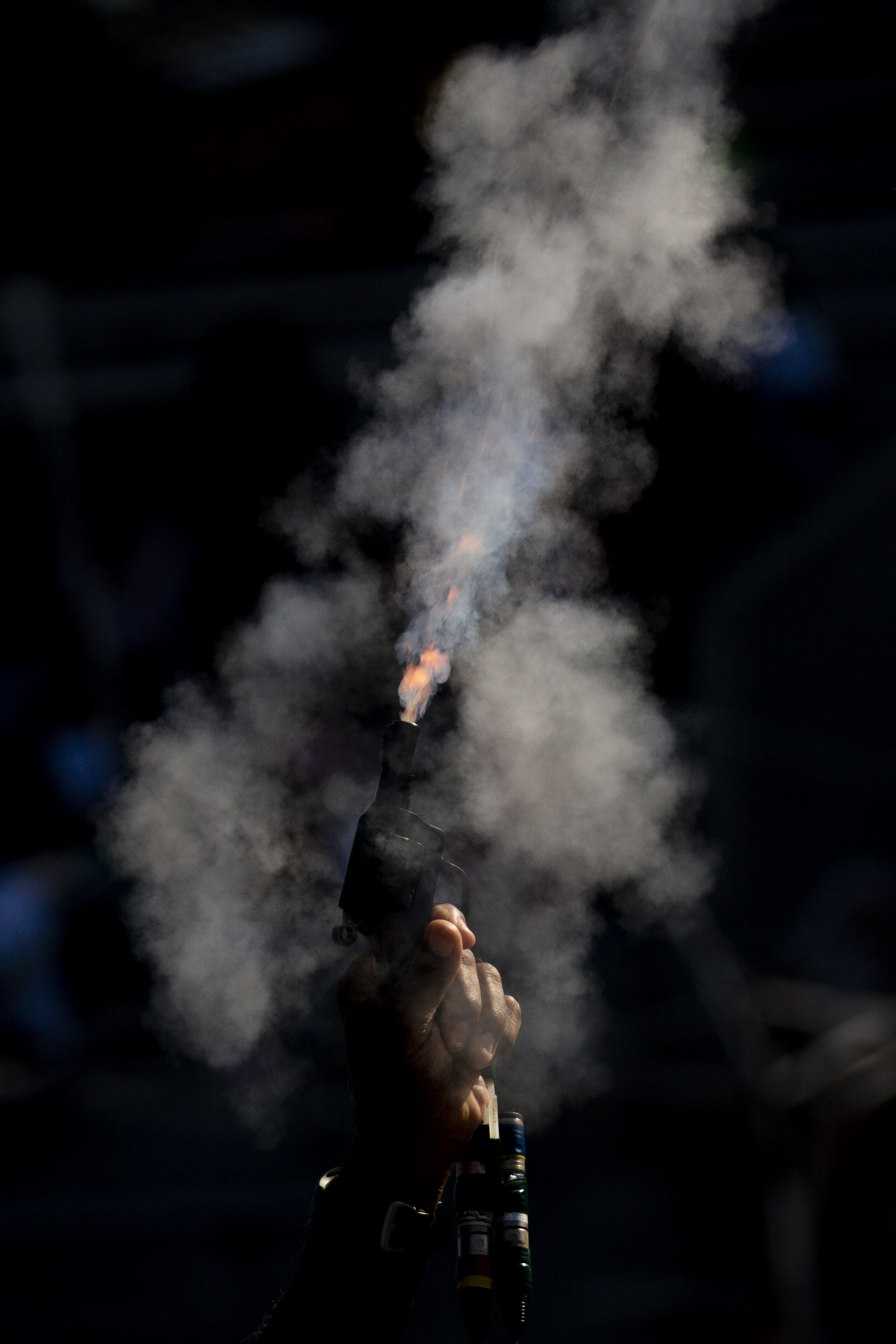  A starting gun is fired during the AAU Junior Olympic Games at Drake Stadium in Des Moines, Iowa August 2, 2018.  