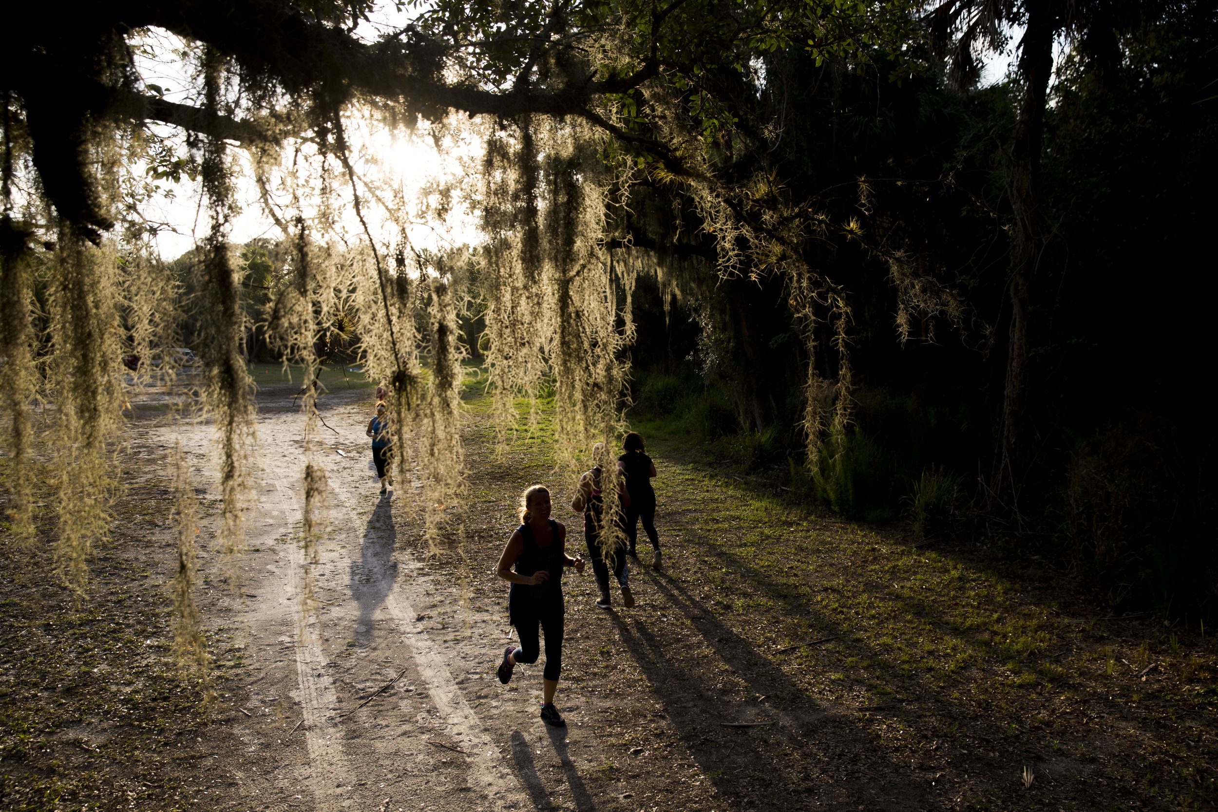  Trainees sprint during one of the final exercises of a Crossfit class during the one-hour session at Koreshan State Historic Site Monday, May 22, 2017 in Fort Myers, Fla. 