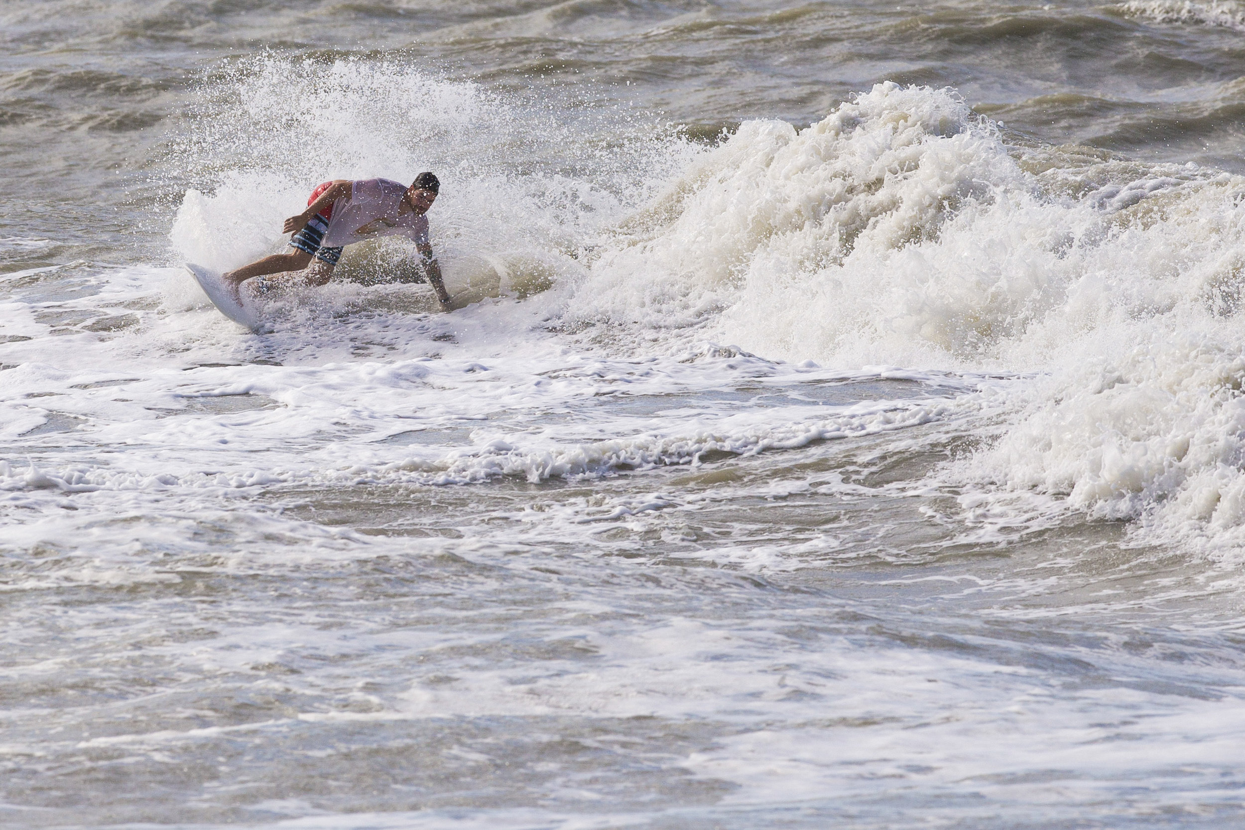  Surfers take to the waves surrounding the Naples Pier as steady winds and high waves force city officials to close the landmark for safety reasons Monday, Jan. 23, 2017. 