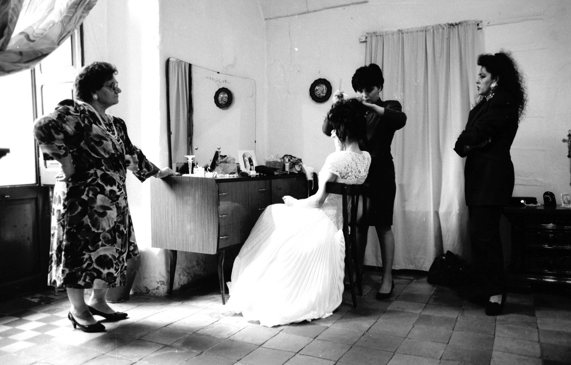  Matera, Italy - 19 October 1991 Preparation and dressing of the bride, assisted by the bride's maids.&nbsp; 