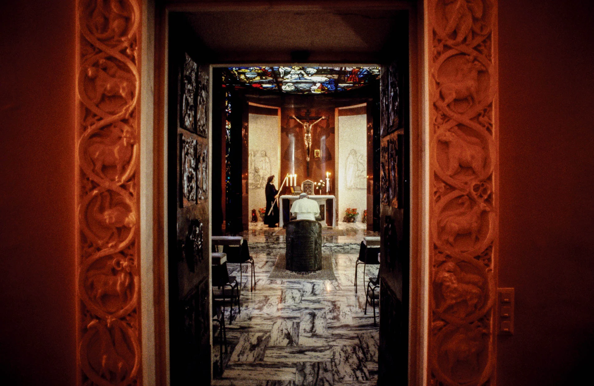 The Vatican - February 1986 A day in the life of the Pope John Paul II in the intimacy of the Vatican: every morning he spends time in silence meditation in the private chapel while a nun prepares the altar for morning mass. 