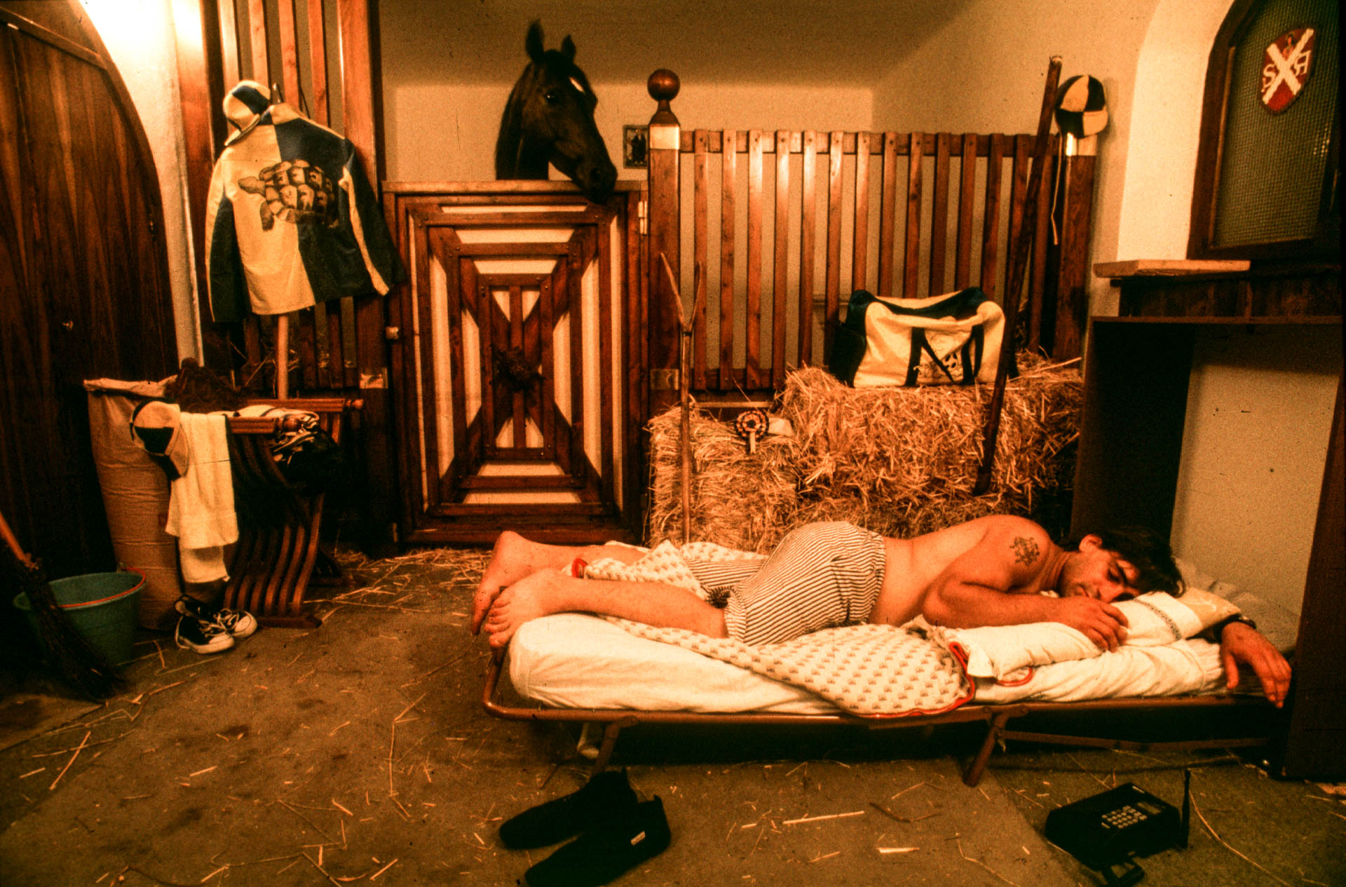  Siena, 1 July 1991 A Tartuca 'contradaiolo' jockey sleeps with his horse the night before the Palio.&nbsp; 