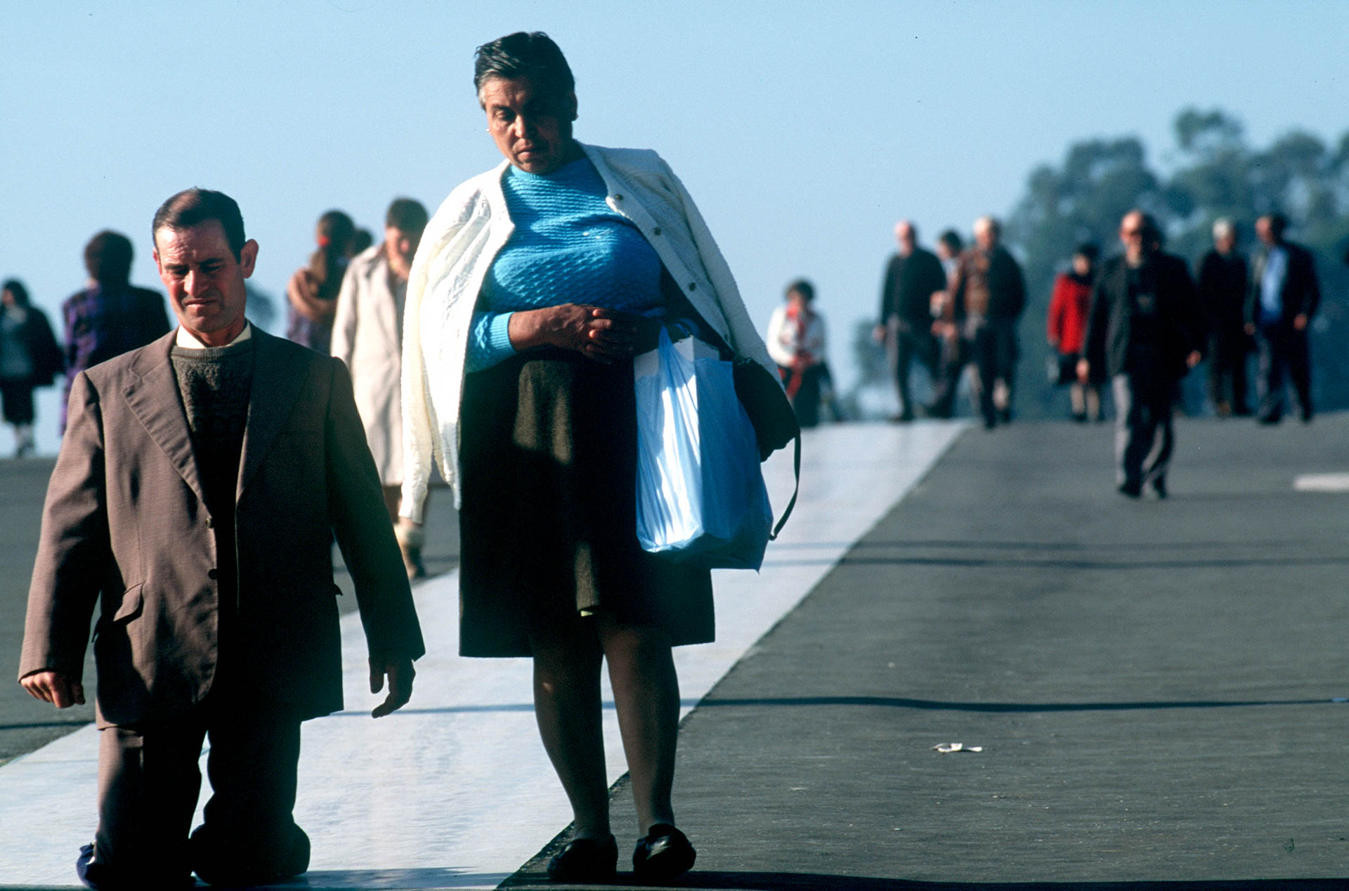  The miracle around the world: Fatima, people on their knees on the road leading to the chapel. 